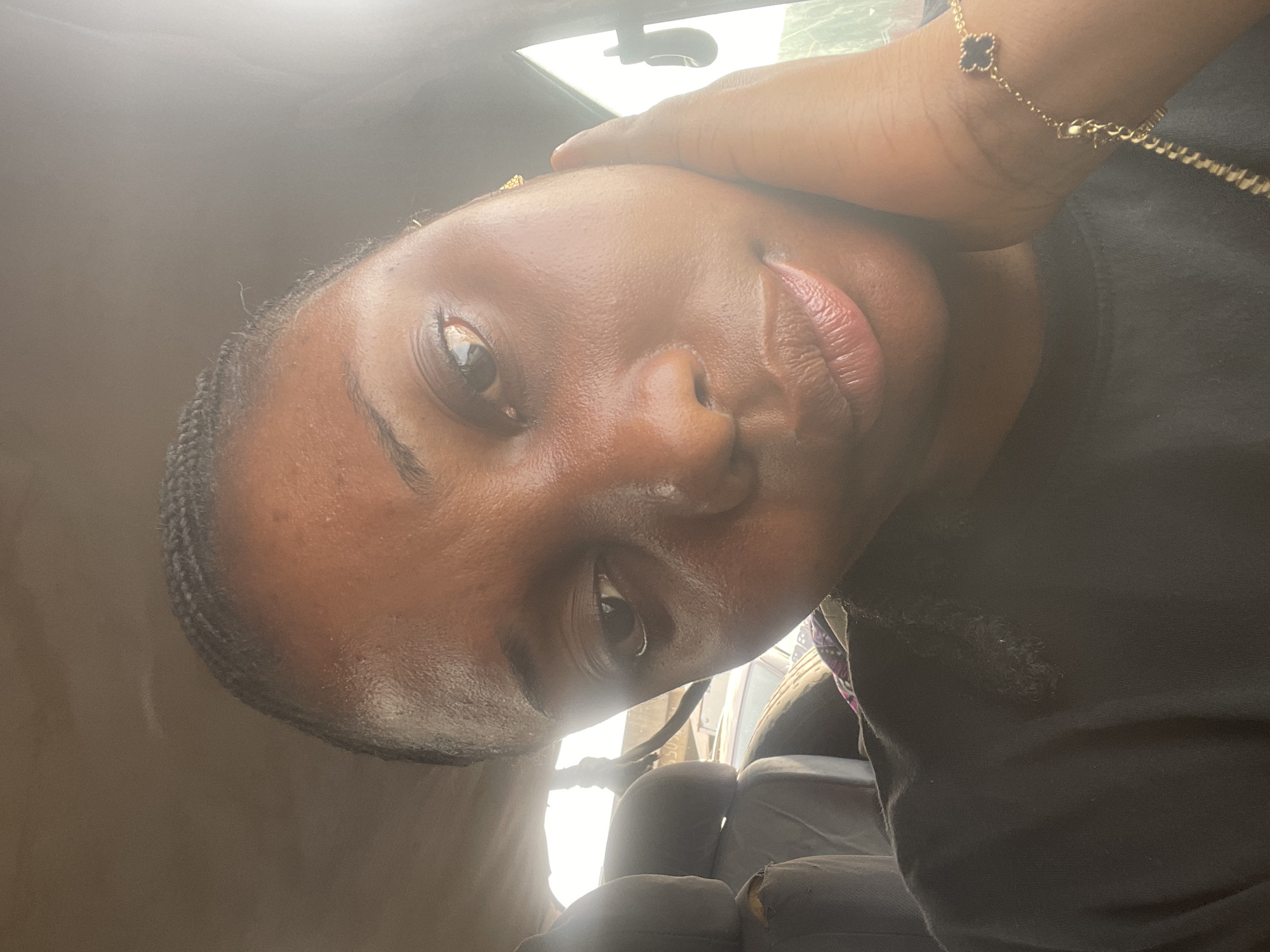 Vehicle passengers document morning street life in Nyanya Nigeria