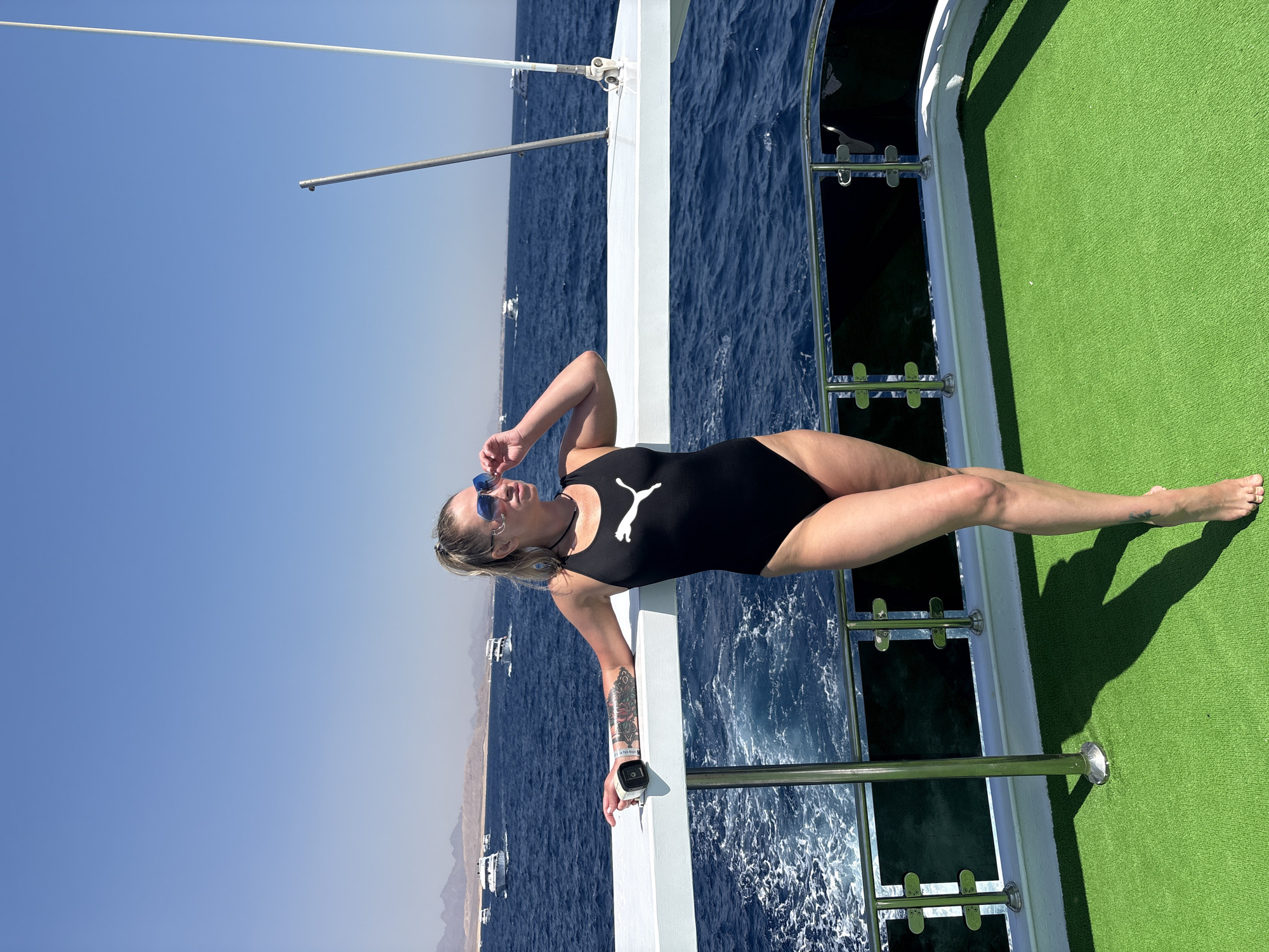 Woman relaxes on boat in Red Sea near Sharm El Sheikh