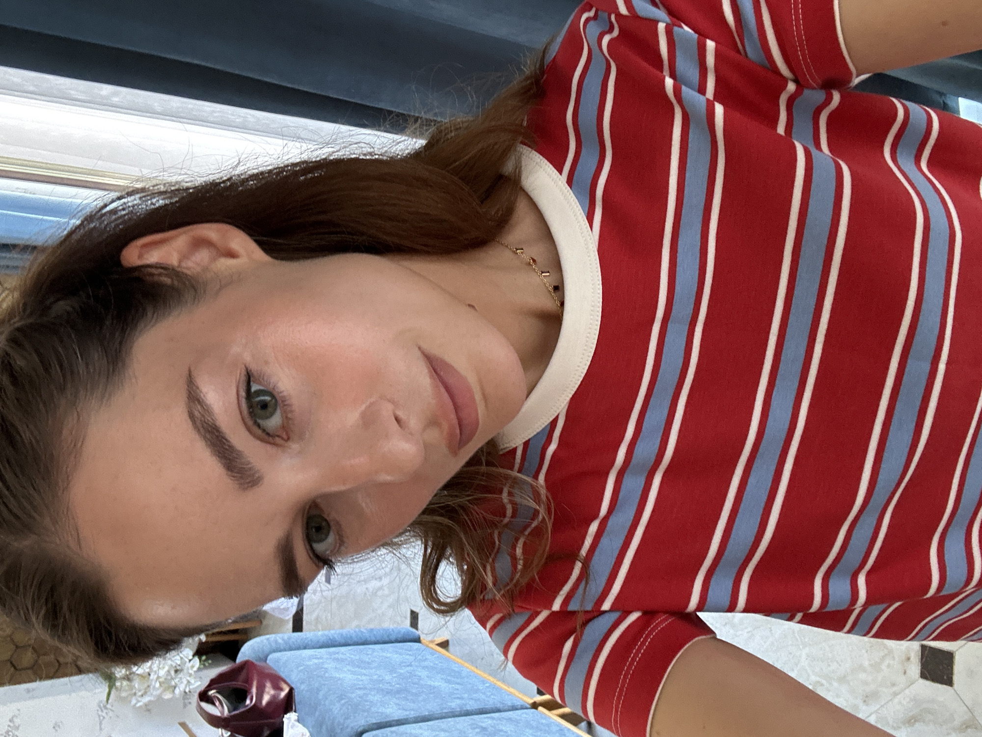 Woman takes mirror selfies in Makhachkala indoor venue
