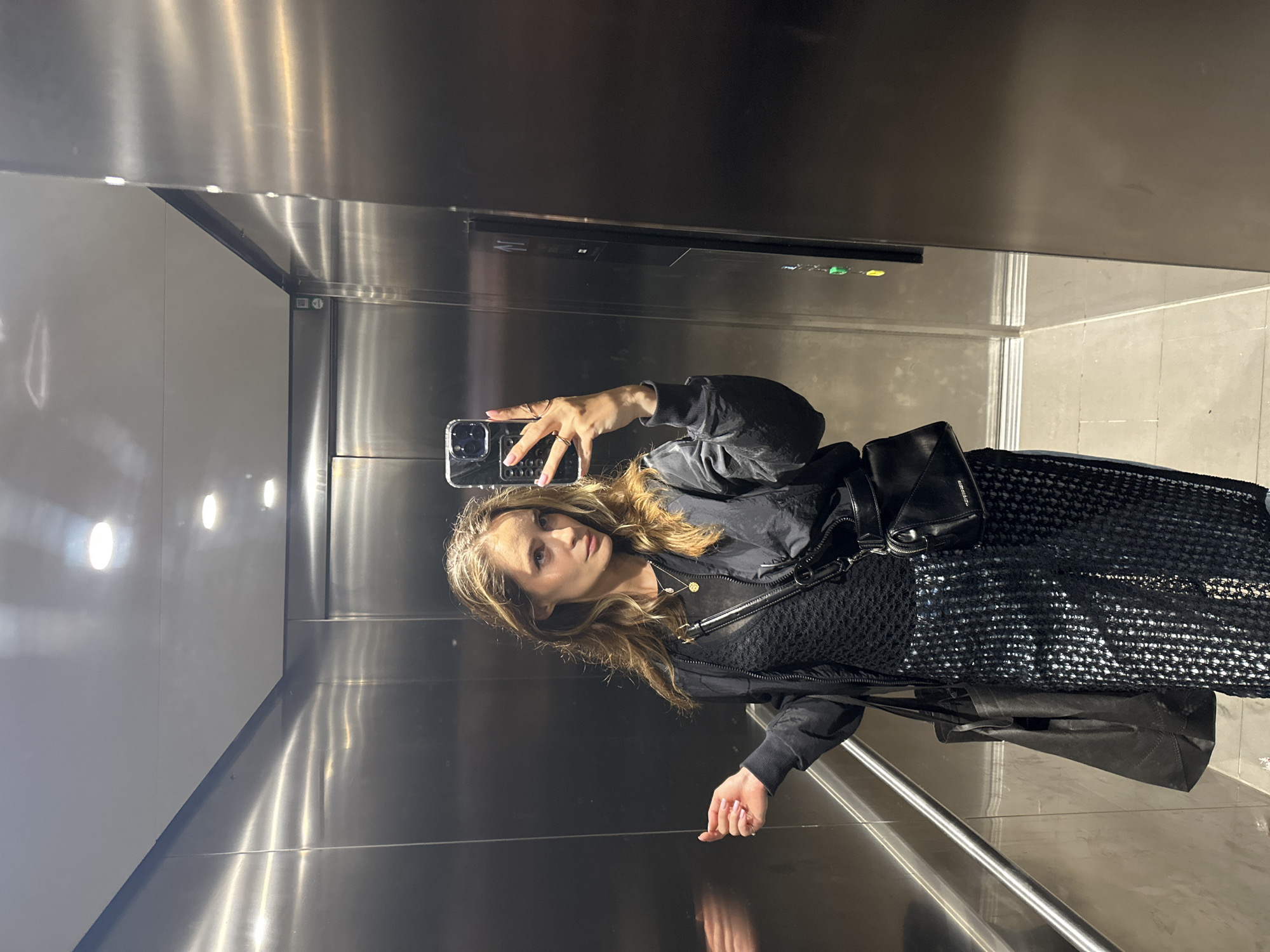 Woman takes elevator selfie in Kiel, Germany
