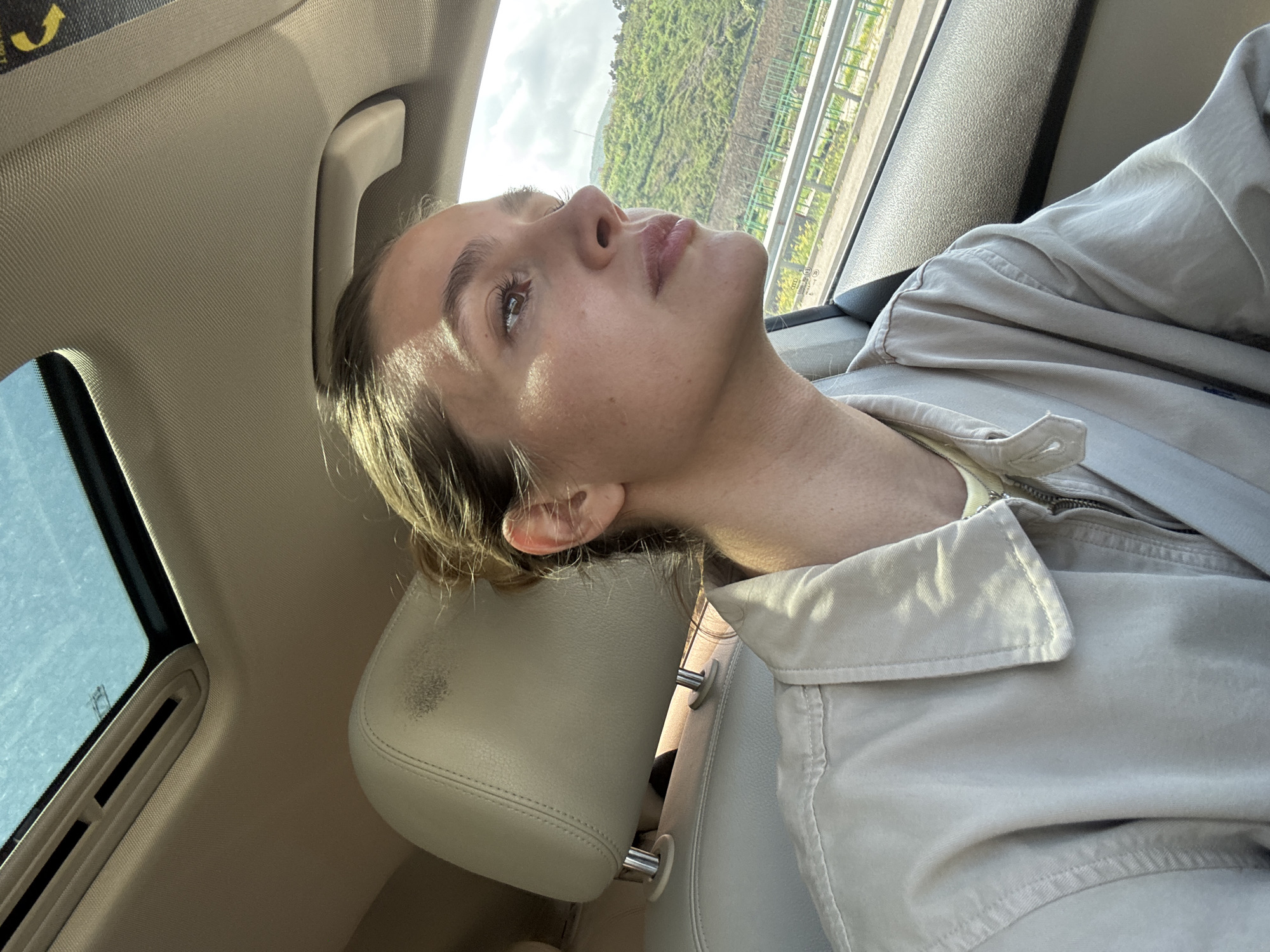 Woman travels by car and elevator, takes selfies