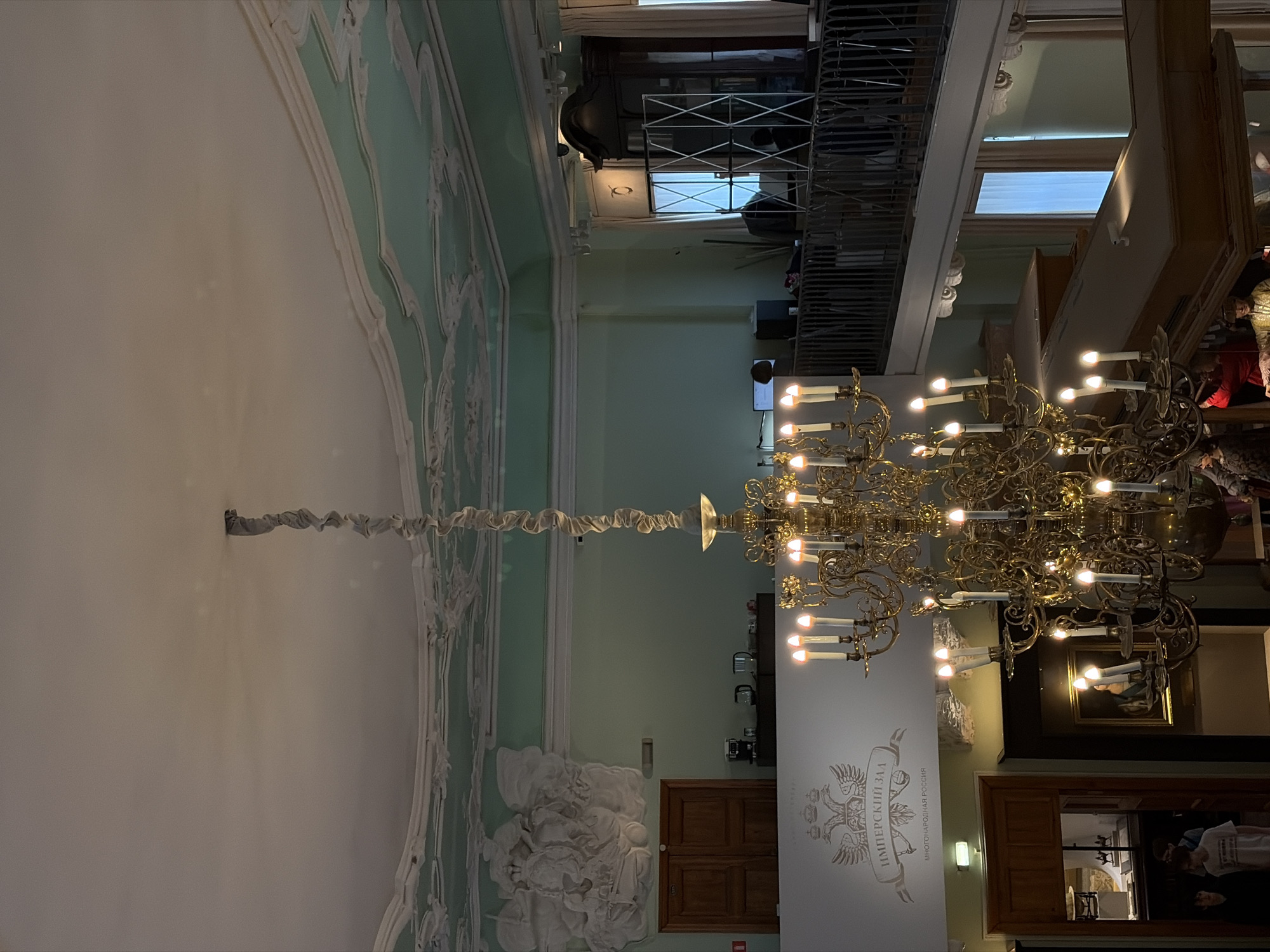 Tourist documents diverse museum exhibits during Saint Petersburg visit