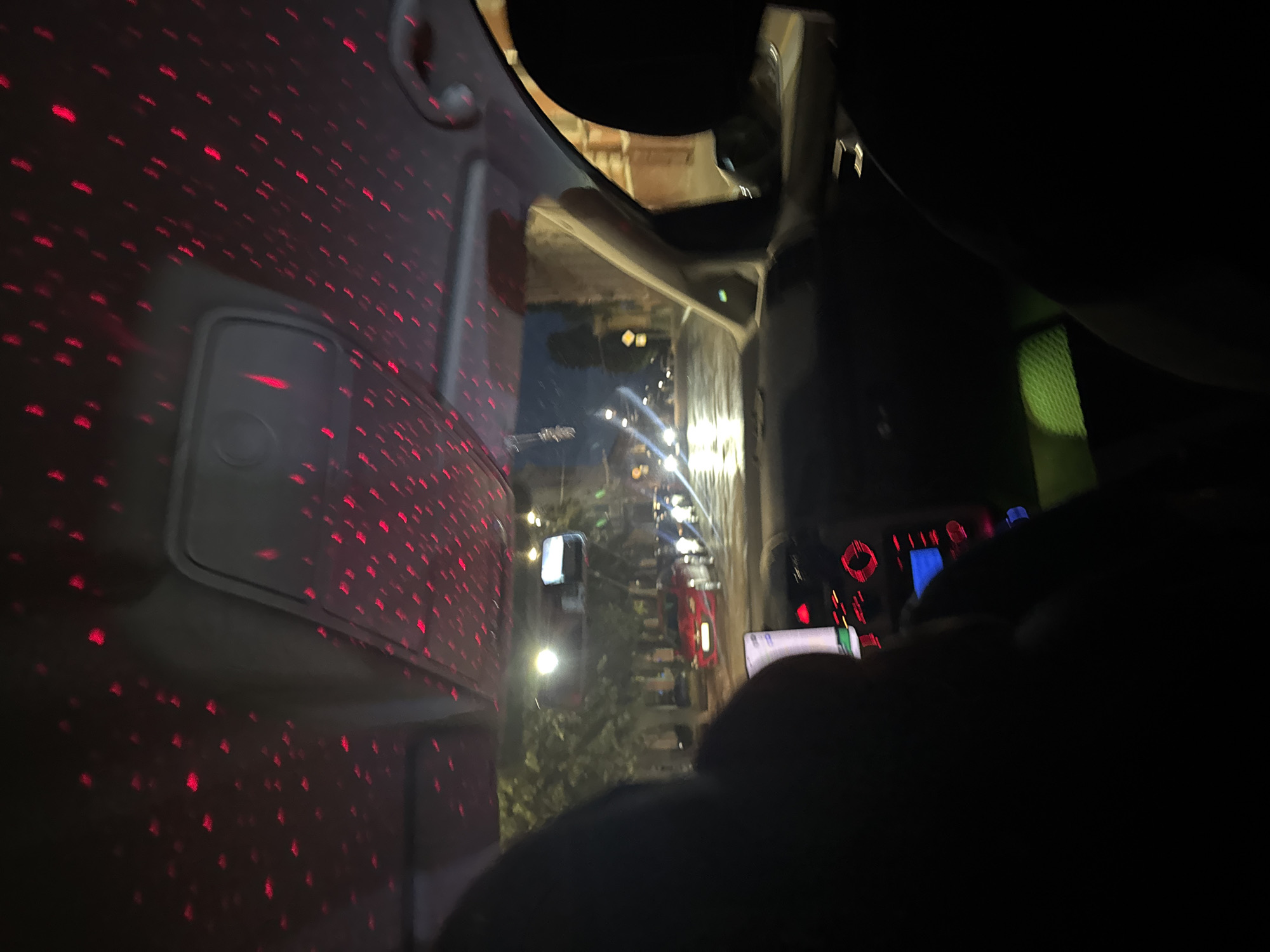 Night drive through Chernivtsi, red light patterns inside the car