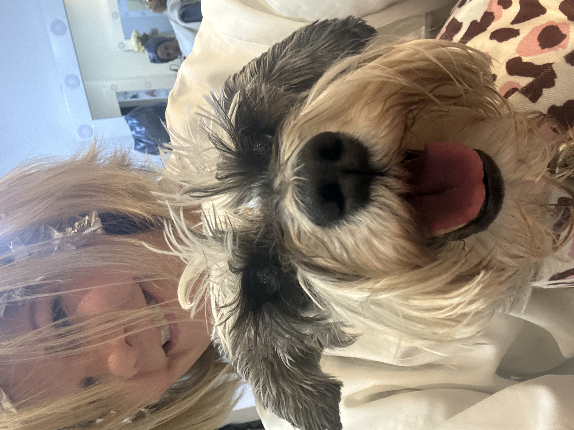 Woman rests with small dog in Huixquilucan home