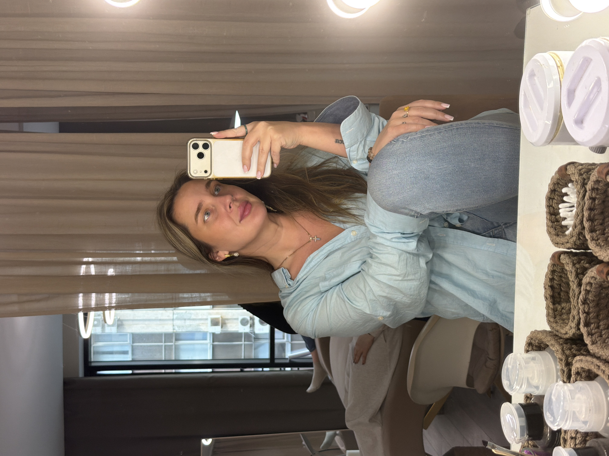 Woman takes selfies in Moscow room Saturday afternoon