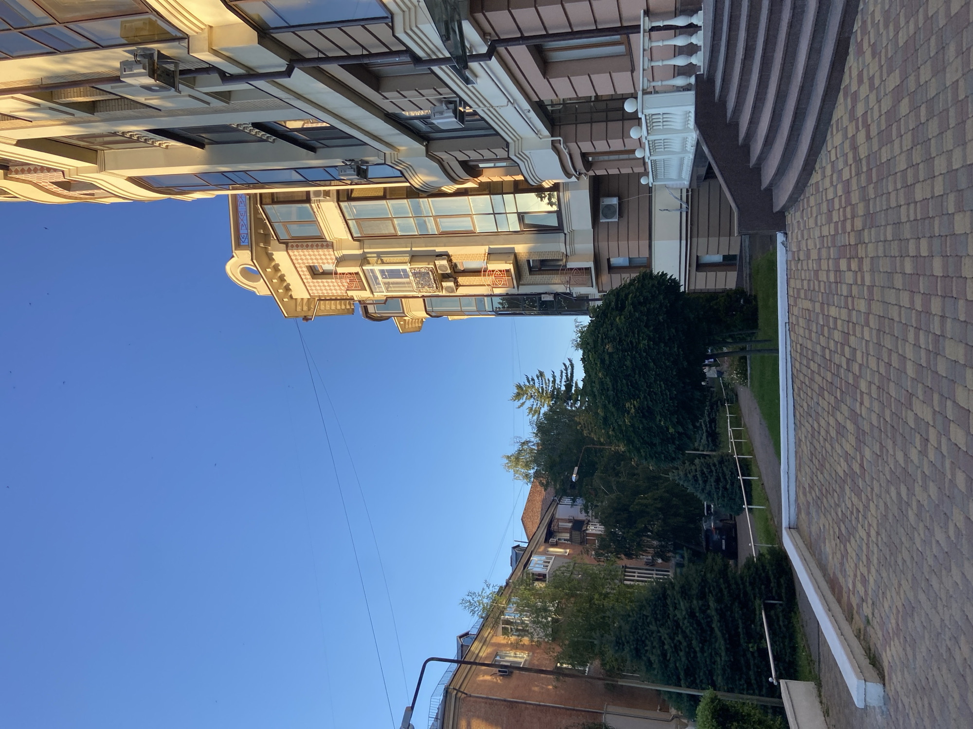 Sunny afternoon stroll through Nyzhni Mlyny's parks and streets