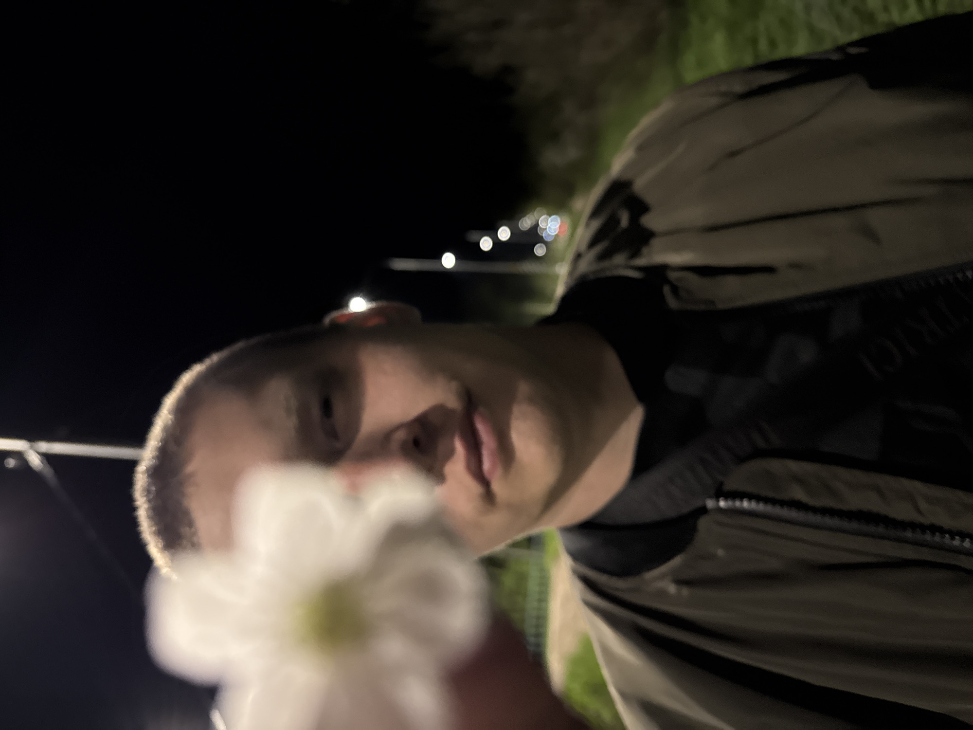 Nighttime flower pose and street exercise captured in Dmitrov