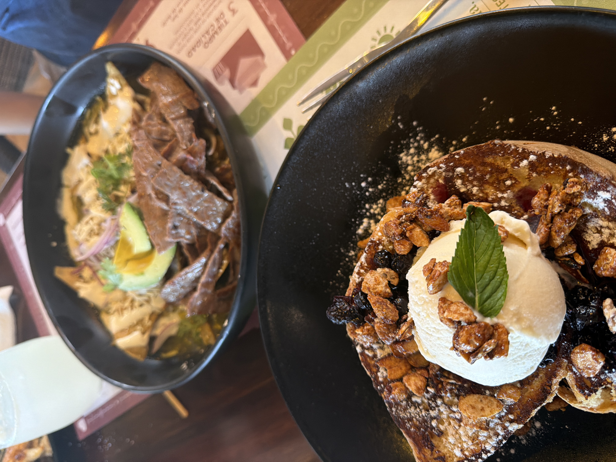 Restaurant meal documented in Puebla featuring chilaquiles and French toast