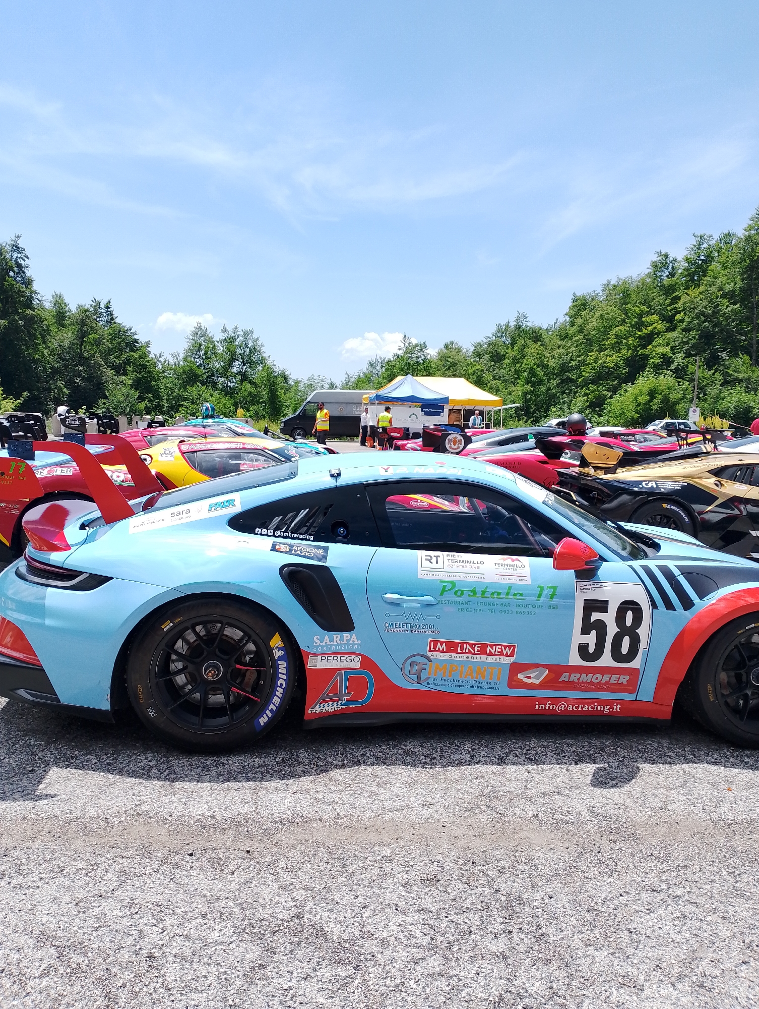 Race day paddock scene at Rieti, with a feline cameo