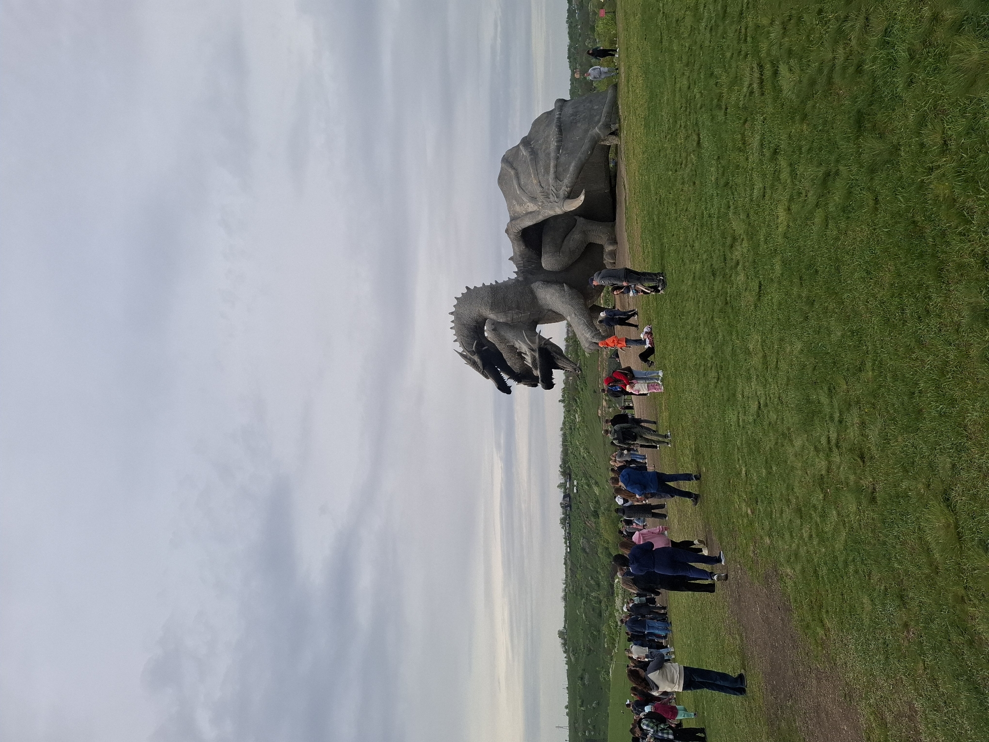 Visitors gather at dragon sculpture park in Алисово, Russia