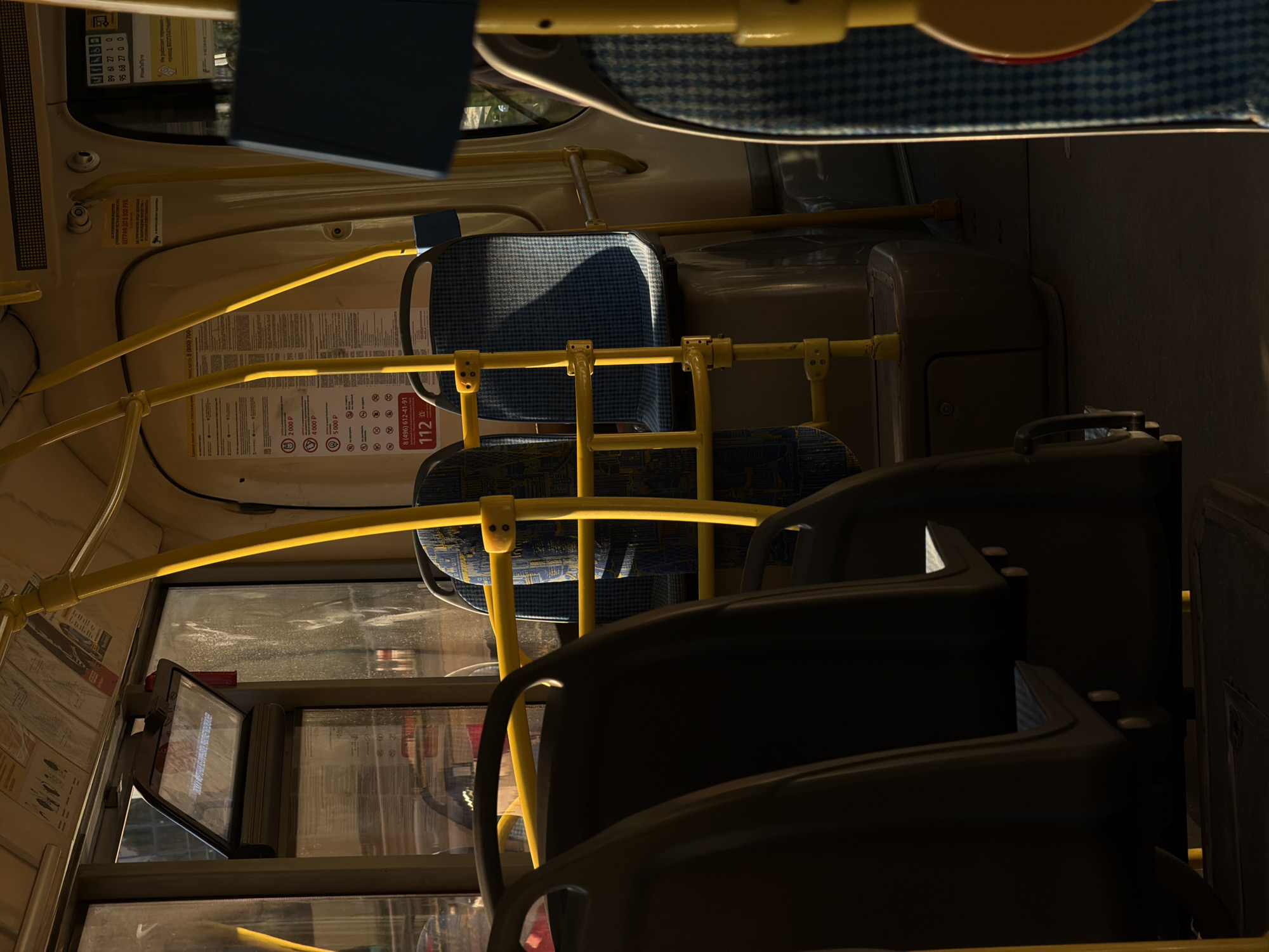 Sunlight and shadows inside a bus near Novodrozhzhino