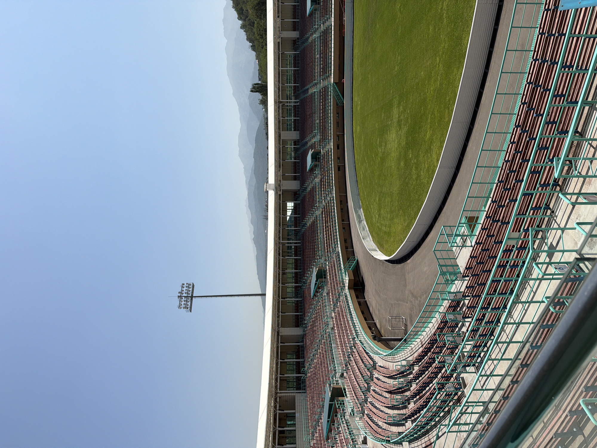 Almaty's Central and Ski Jump stadiums on a sunny day