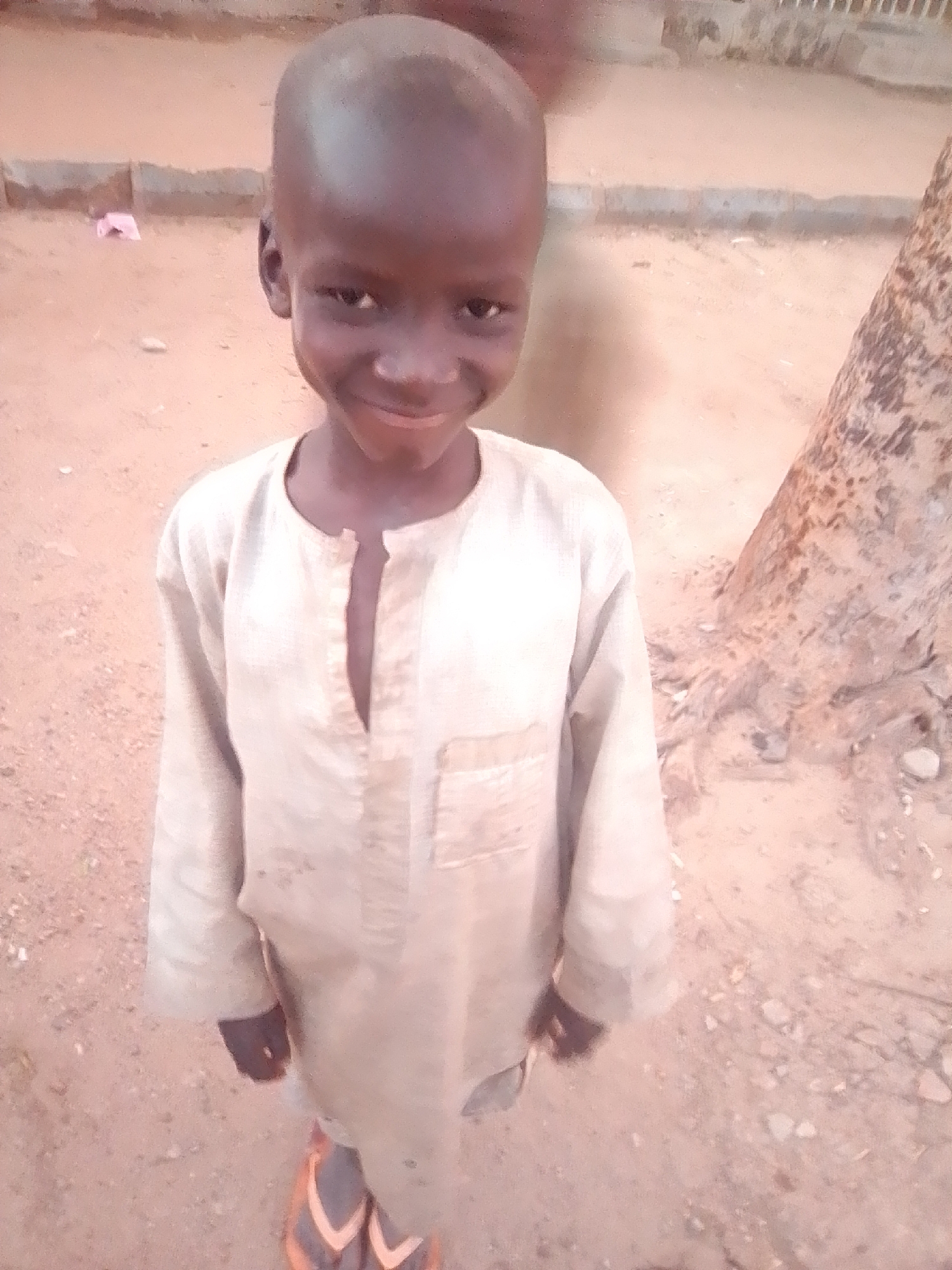 Everyday street life in Gombe at golden hour