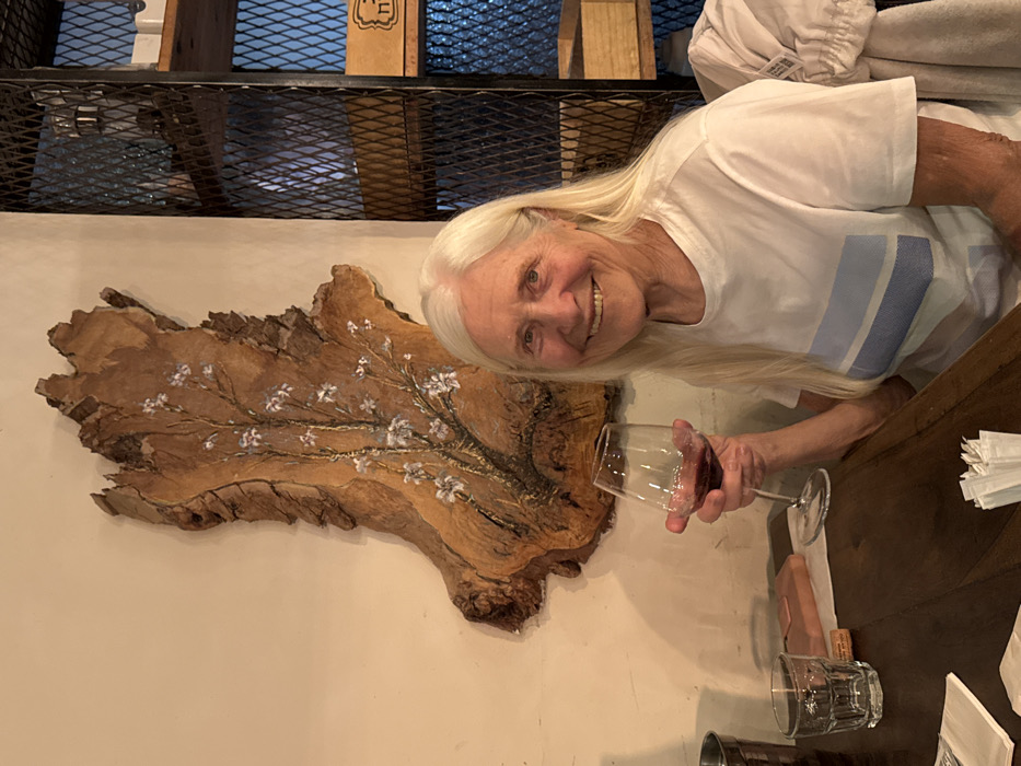 Elderly woman enjoys dinner at upscale Eilat restaurant
