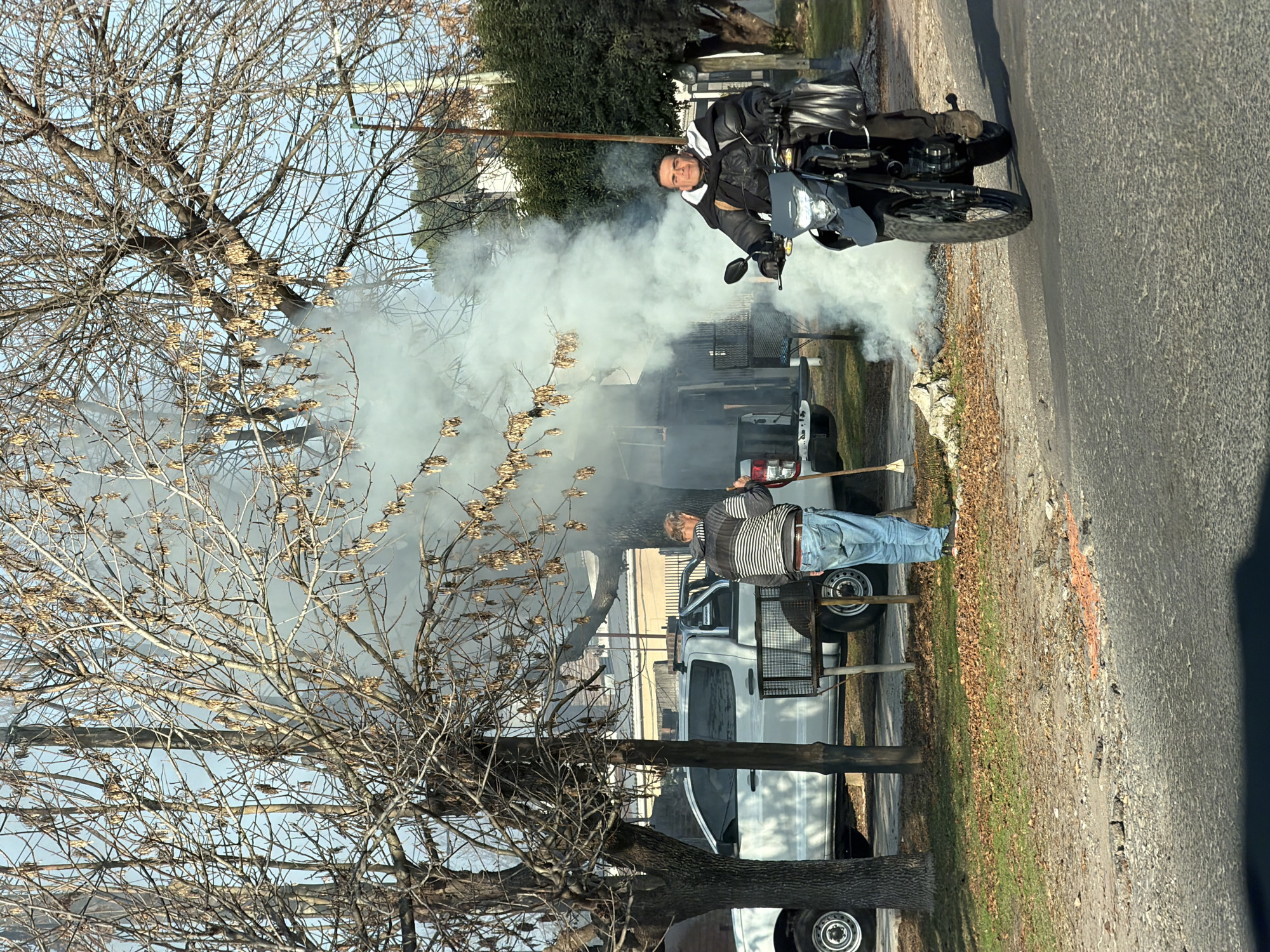 Street scene captured in San Carlos showing motorcyclist and pickup truck
