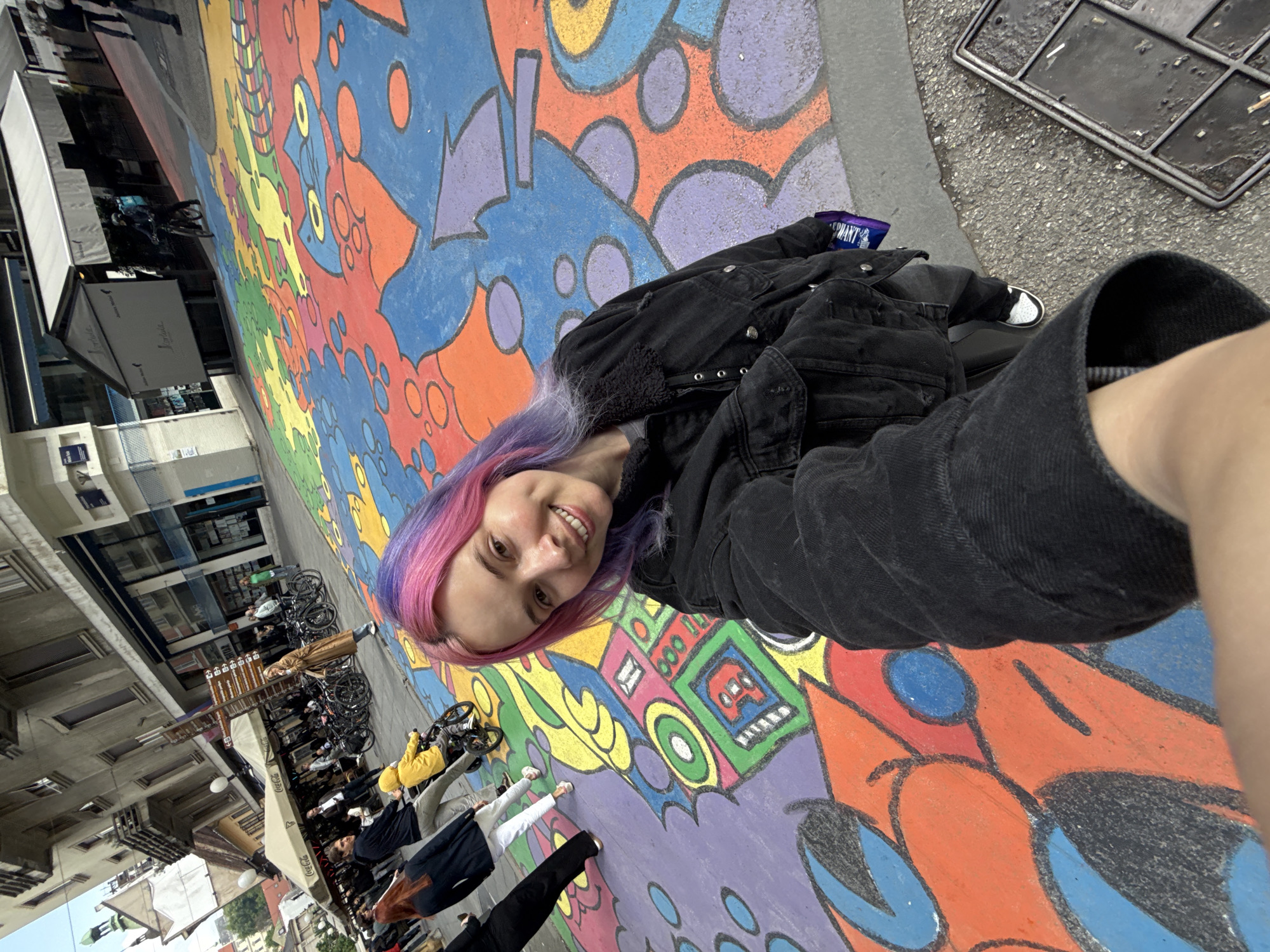 Tourist documents Zagreb street art and chocolate shops during morning walk