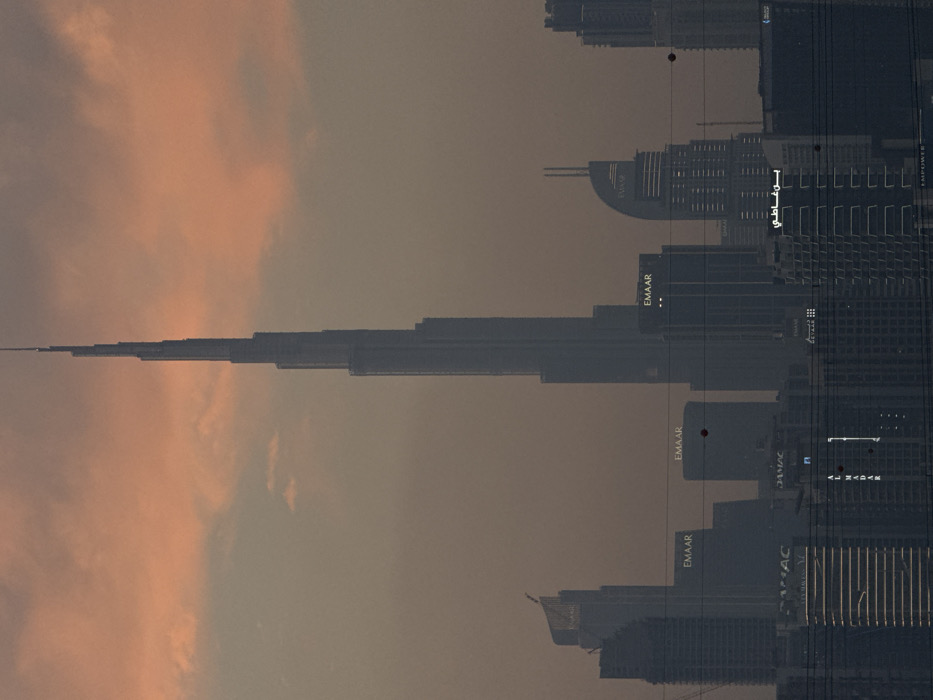 Dubai skyline and aircraft observed during golden hour