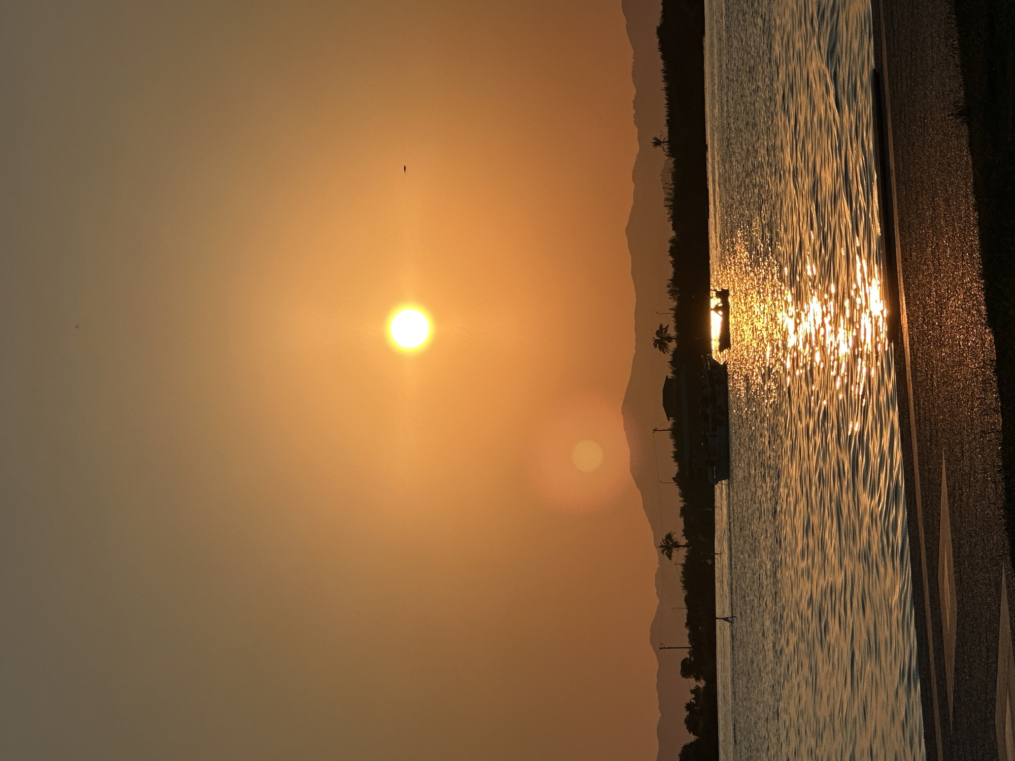 Golden hour at the Fethiye waterfront — park, path, and bay