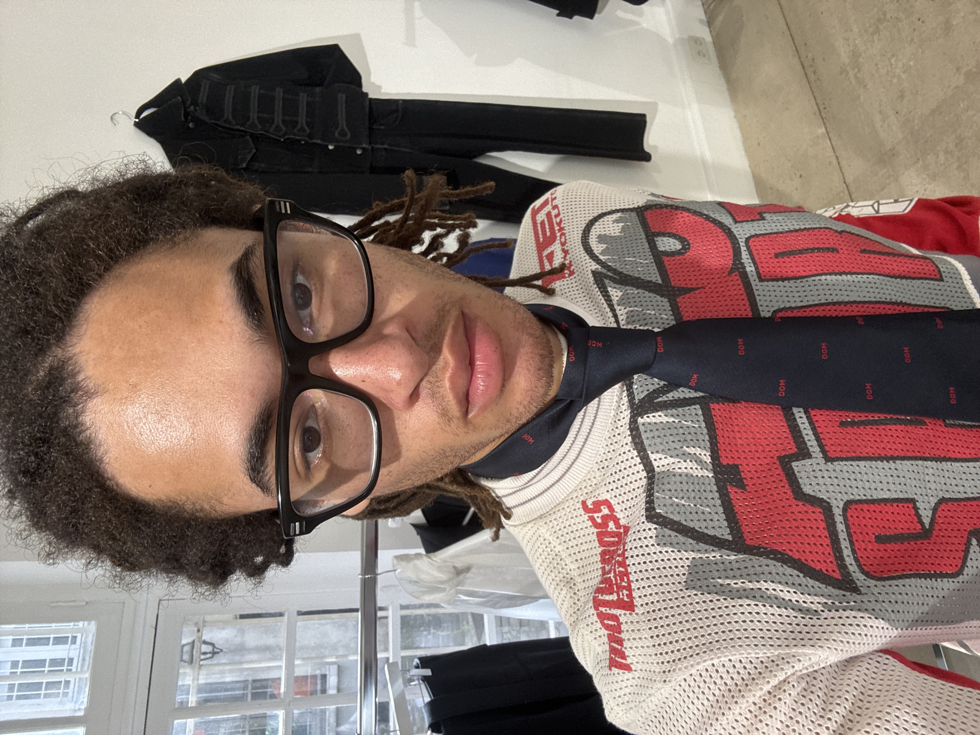Person browsing clothing store in Paris holds mysterious wallet