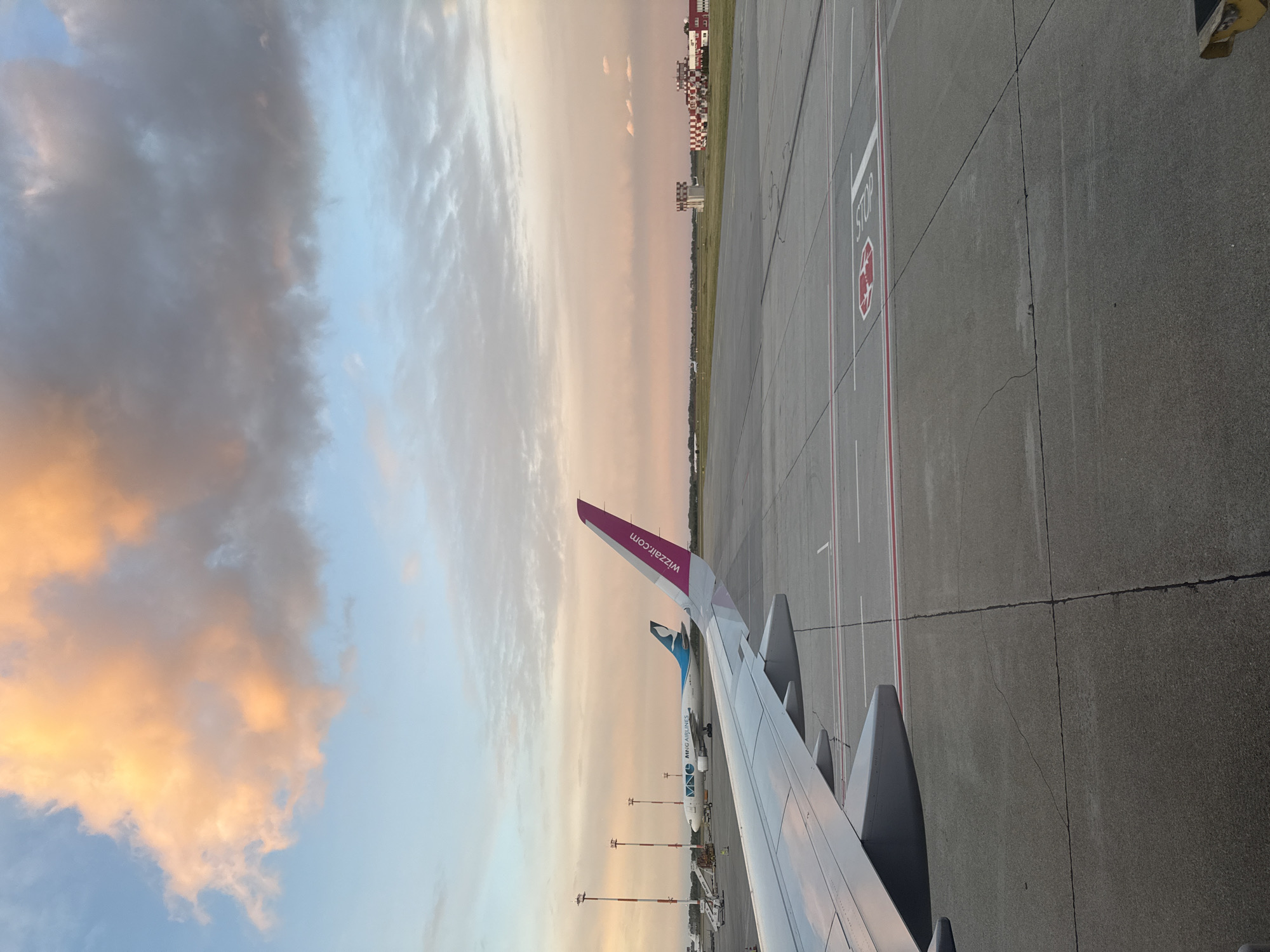 Wizzair flight arrives at Bratislava Airport during evening hours
