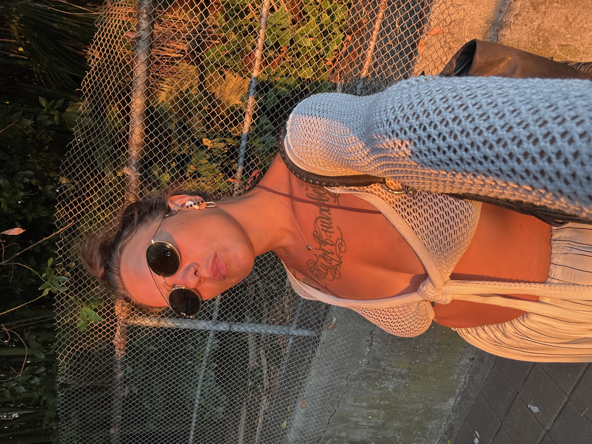 Golden hour selfies by a fence in Sochi, summer 2026