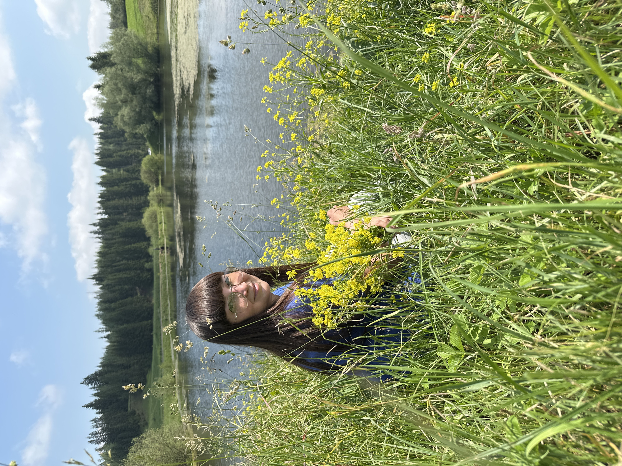 Morning lakeside retreat in Russian countryside with fishing and wildflowers