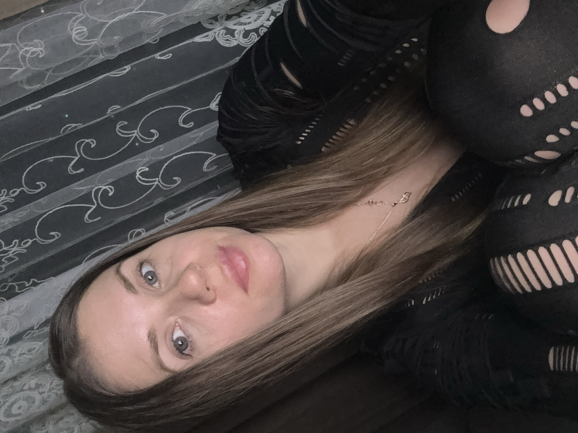 Woman observed indoors in Batumi, Georgia evening hours