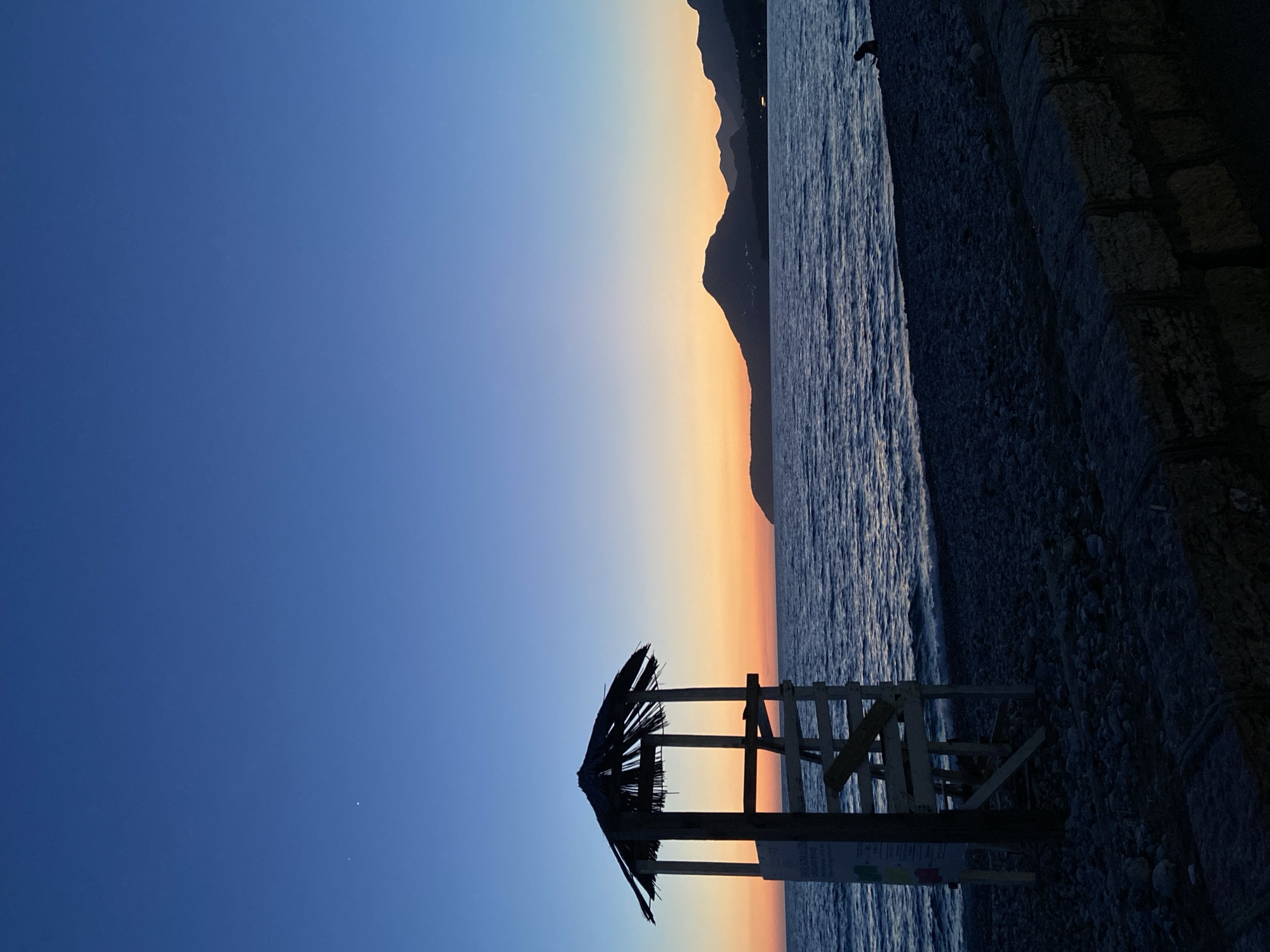 Evening coastal scenes and Cyrillic displays documented in Bar