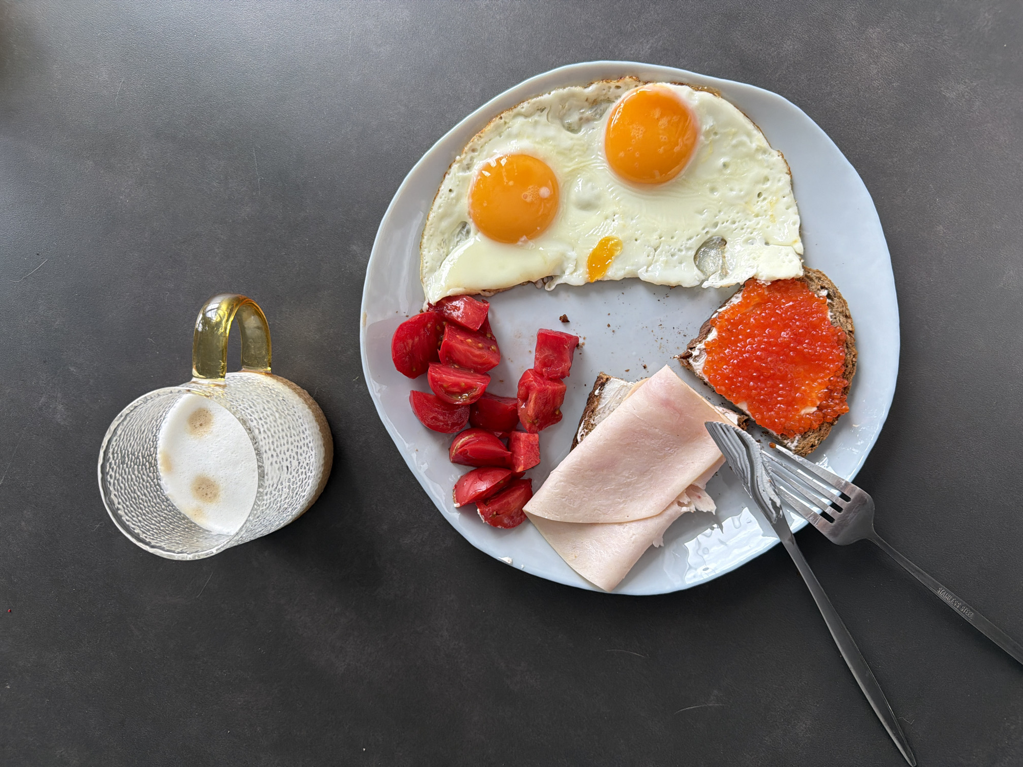Breakfast meal with eggs, caviar bread documented Monday morning