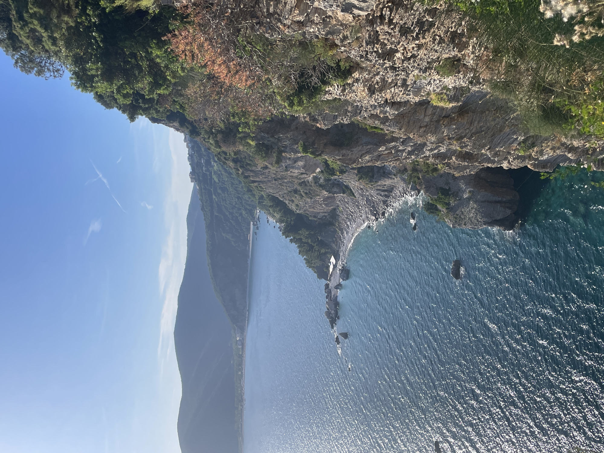 Tourist documents scenic Adriatic coastline views around Budva, Montenegro
