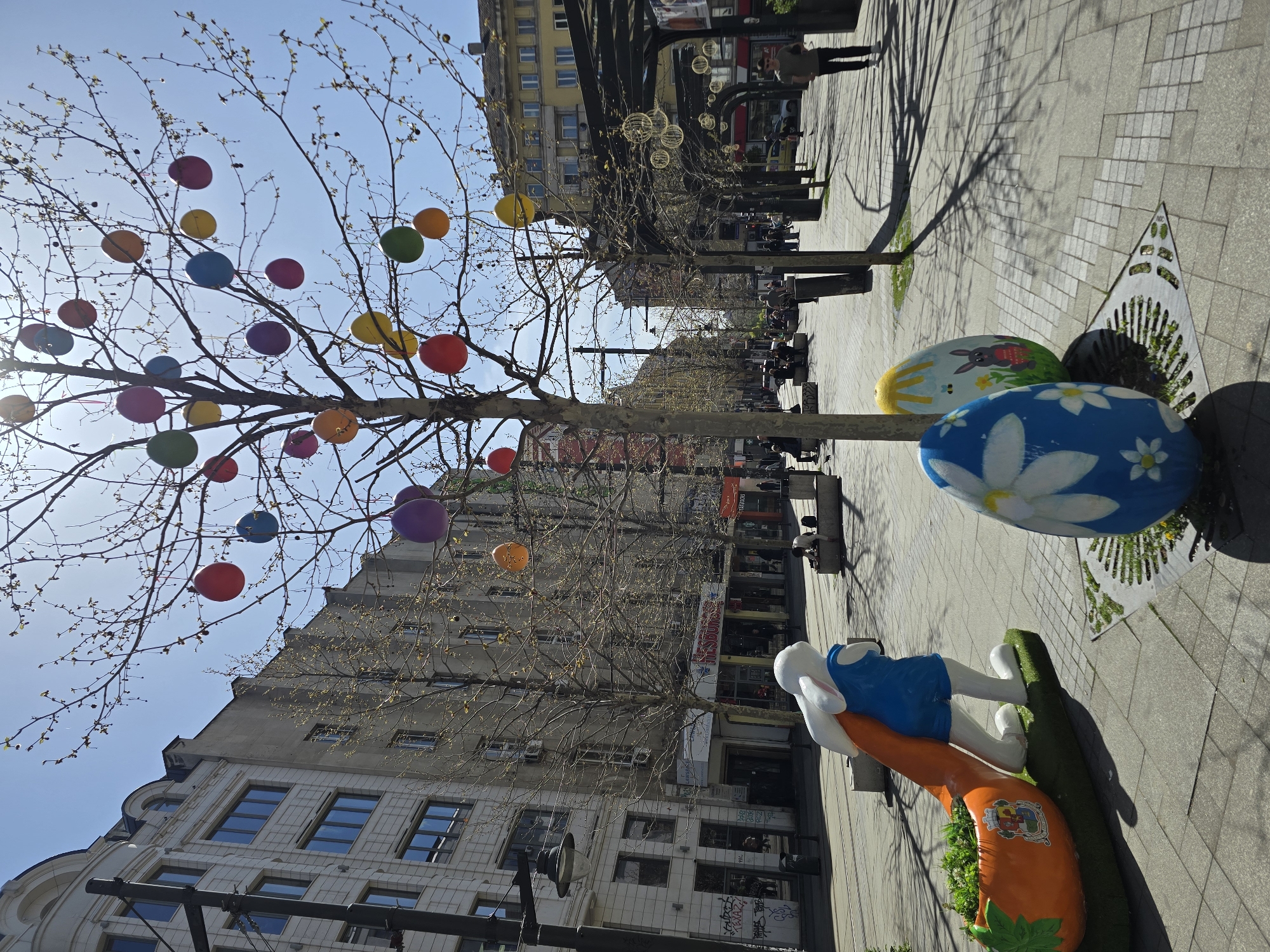 Easter decorations and flowing fountain captured in sunny Sofia