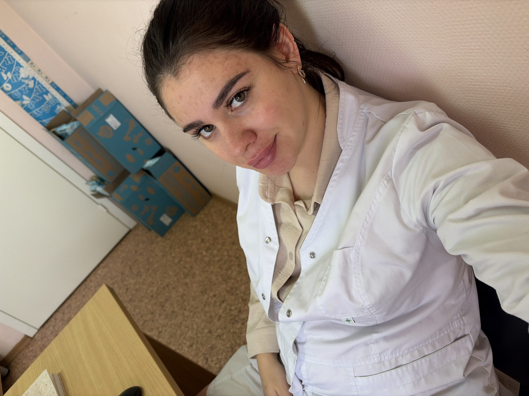 Candid moments in a white lab coat, indoors in Russia