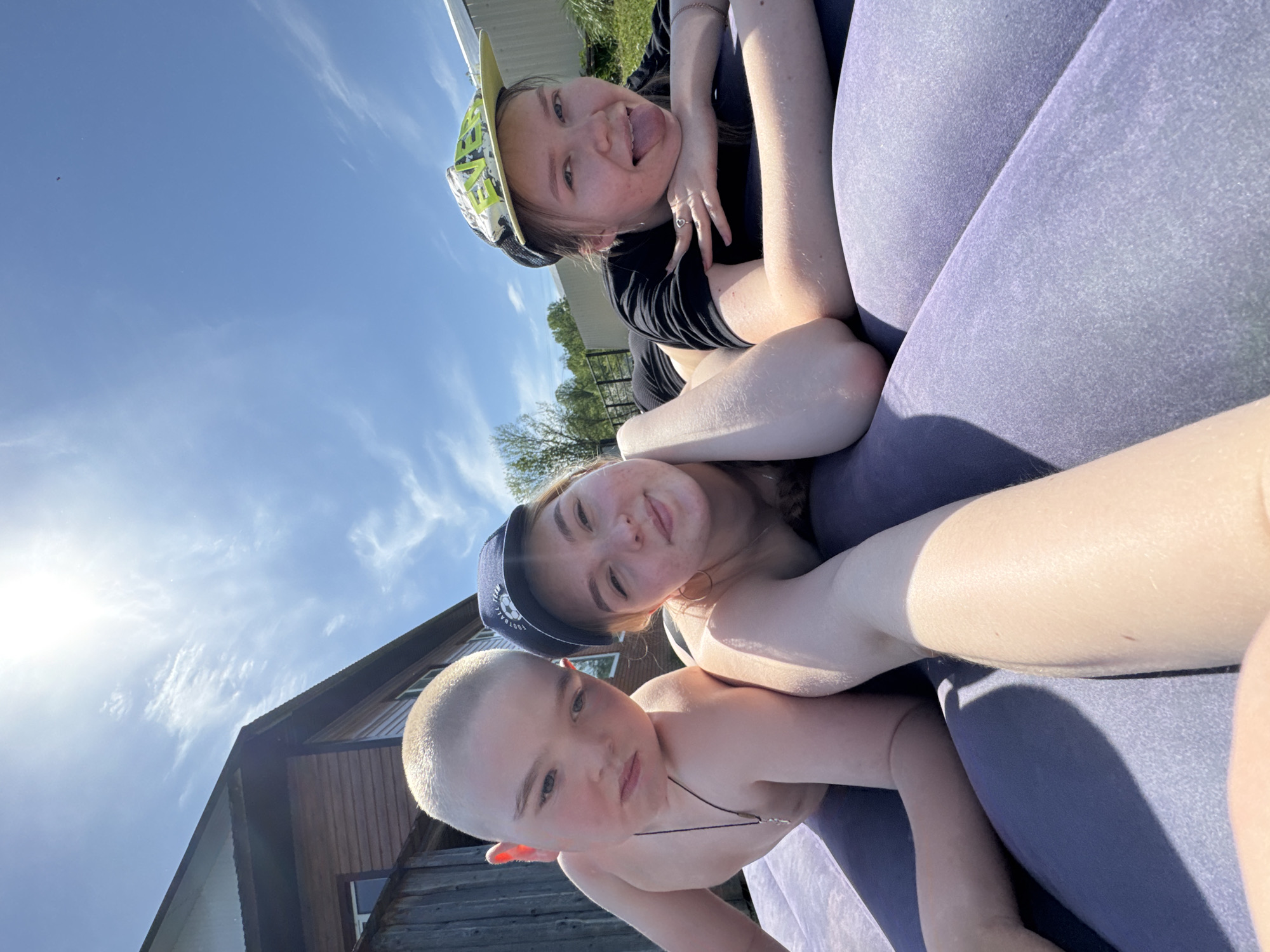 Family enjoys inflatable mattresses in Russian backyard