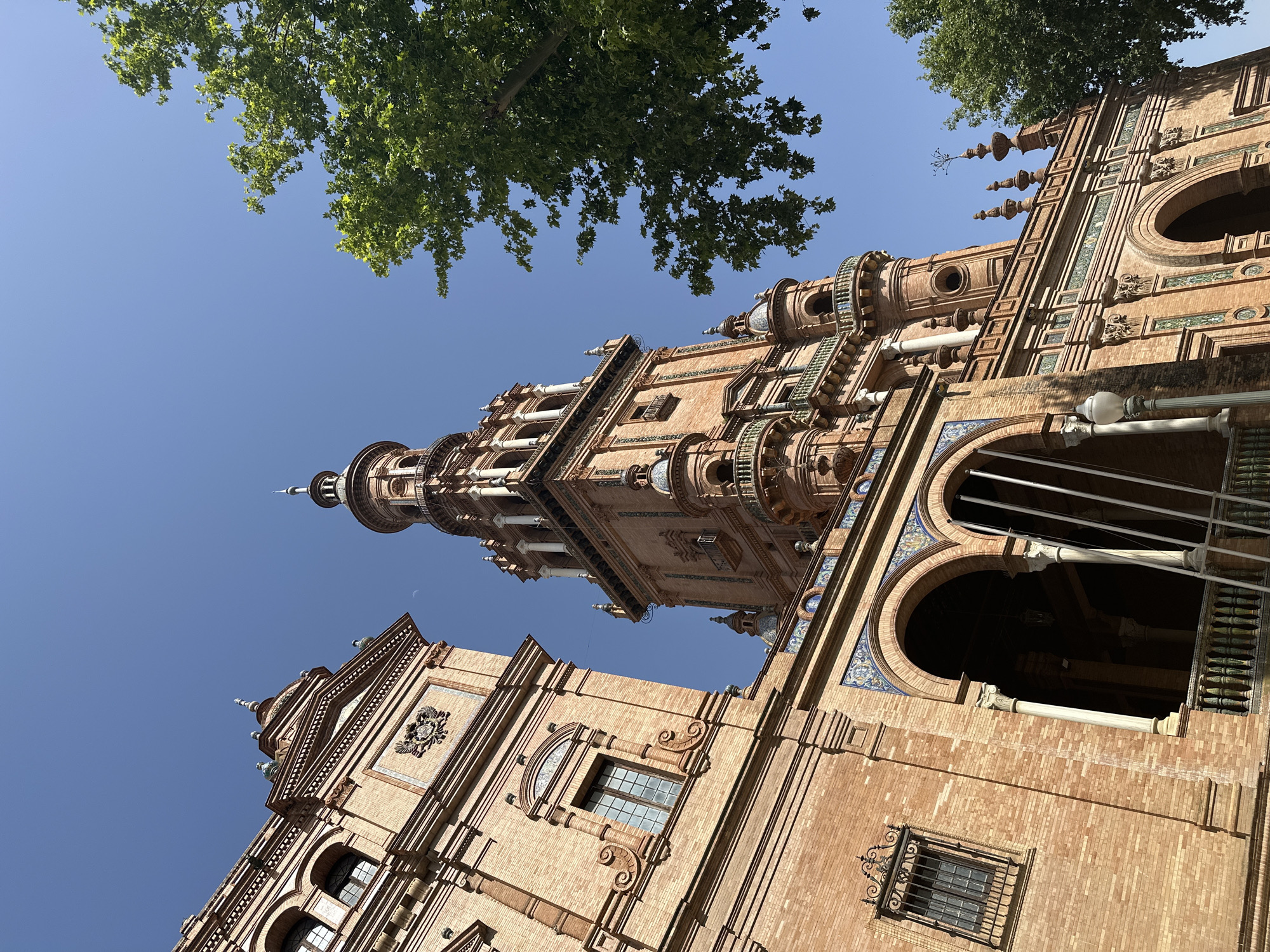 Ornate building photographed in Seville against blue sky