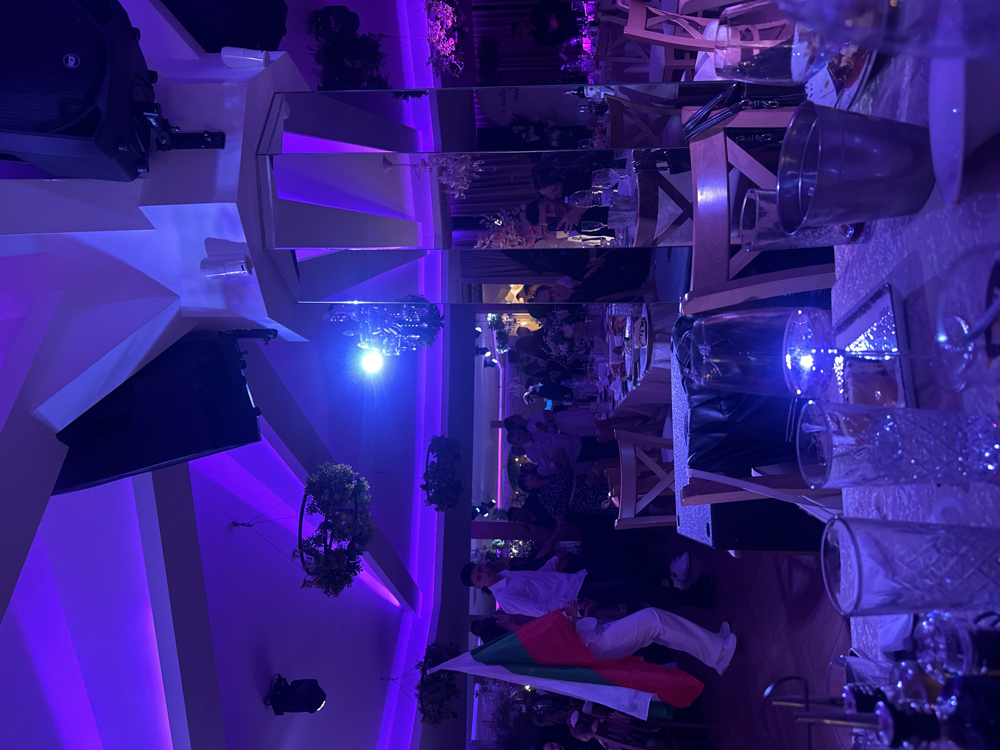 Reception event underway in Blagoevgrad hall with violet lighting