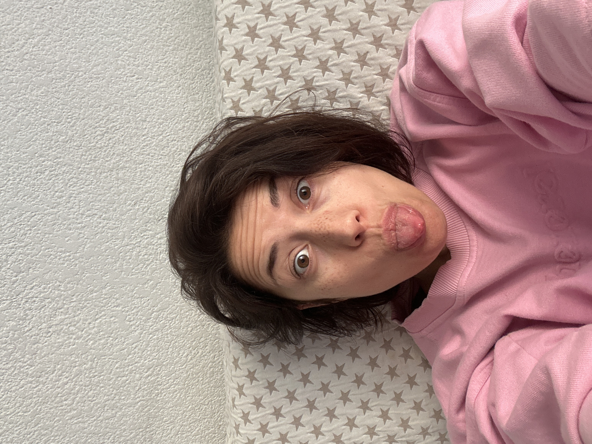 Person makes playful expression in indoor portrait, Barcelona