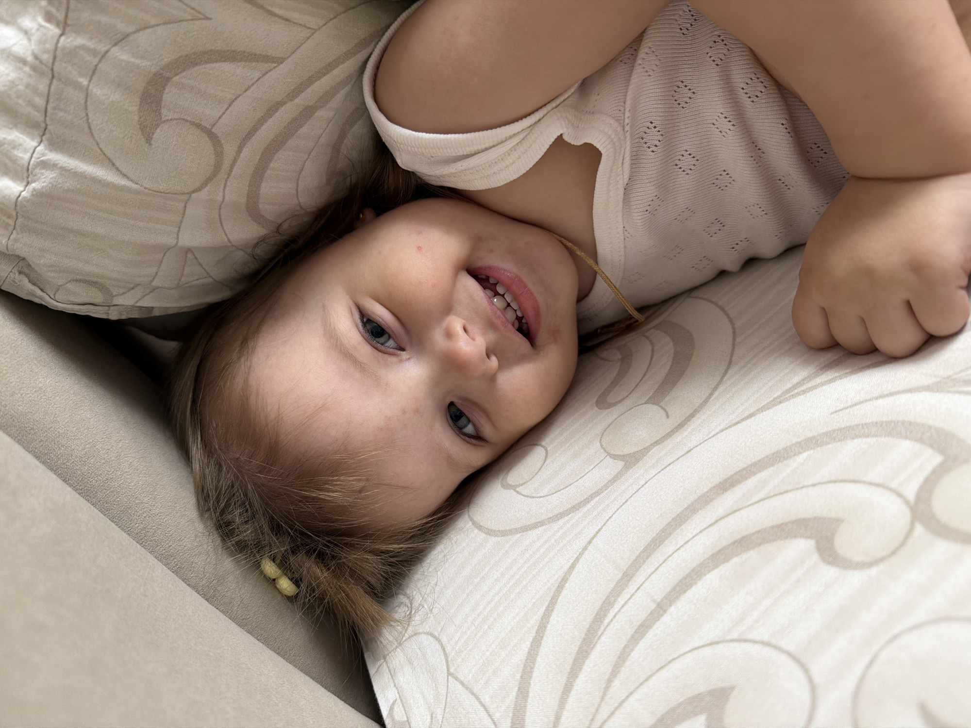 Young girl photographed on cushion in Reshetnikovo, Russia