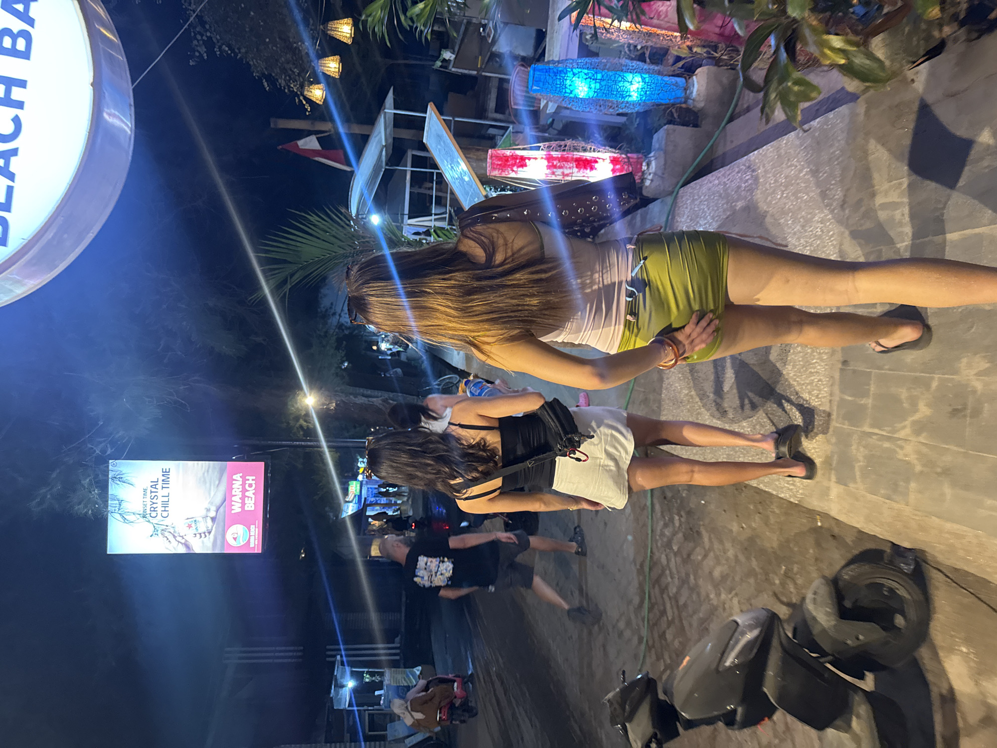 Nighttime beachside dining scene in Lombok, Indonesia