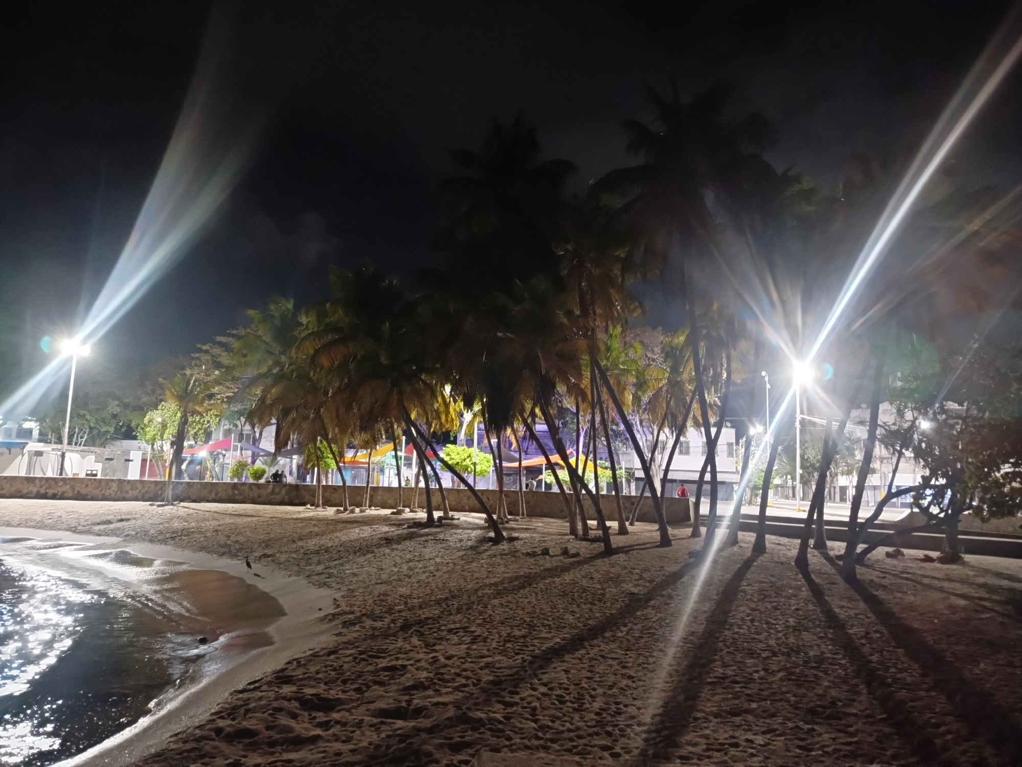 Nighttime walk documented through Juan Griego's streets and waterfront