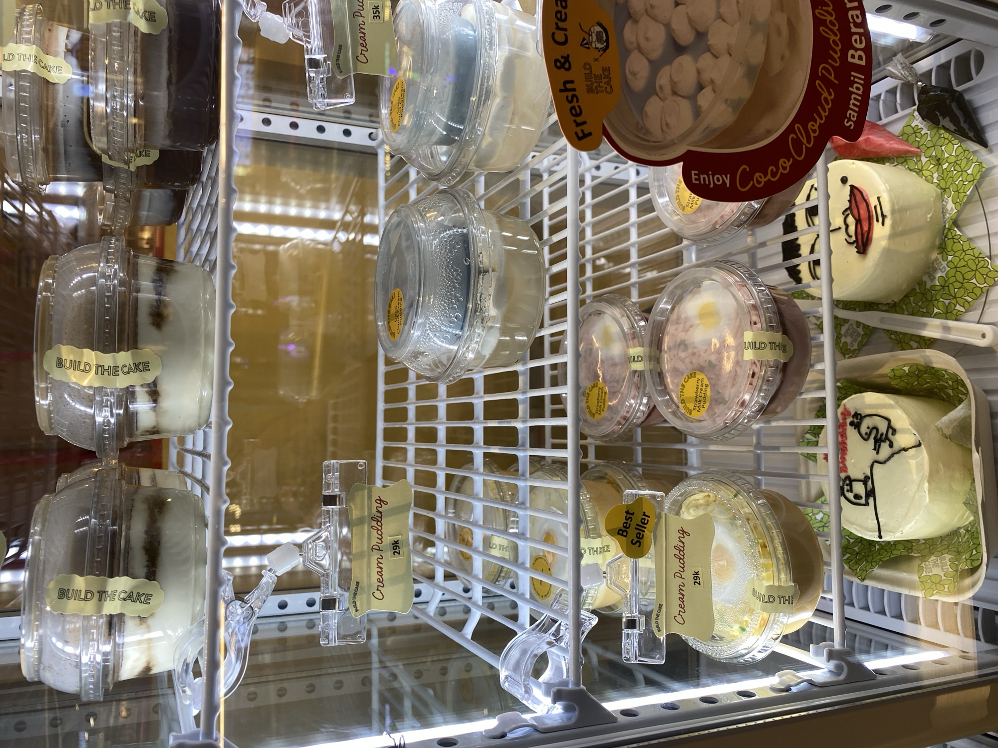 Inside a Jakarta mall's cake shop and surrounding retail floors