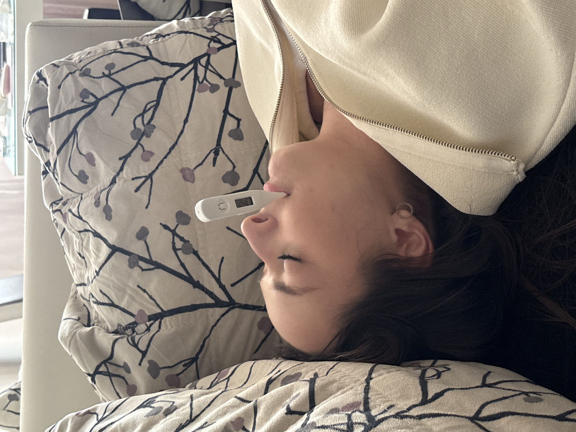 Woman takes temperature reading while resting in Kragujevac
