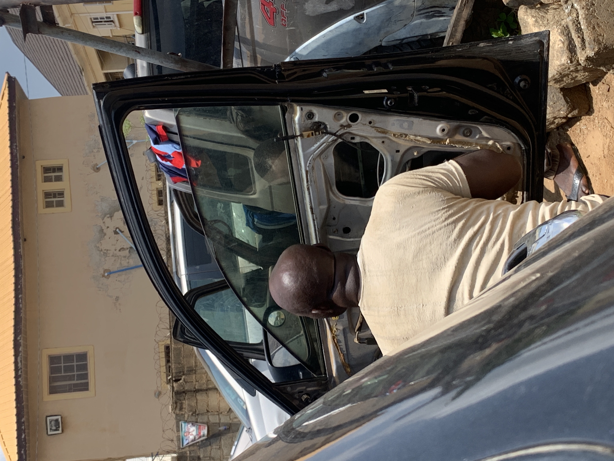 Car repairs and daily life captured in Kagini, Nigeria