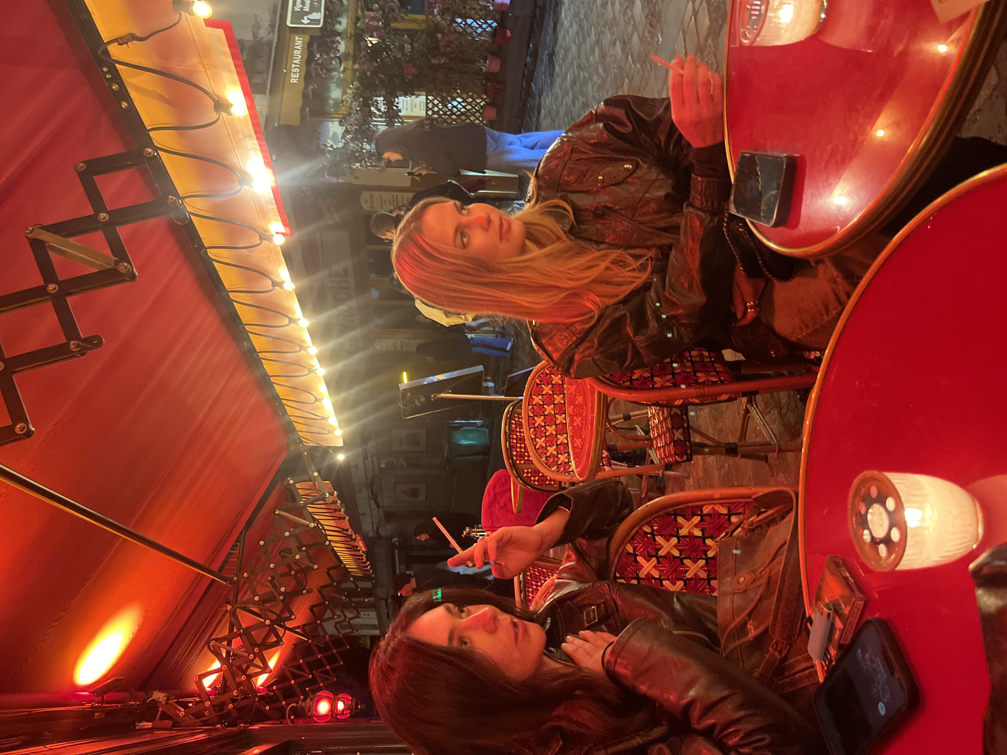 Women document Paris night out at restaurant and bar
