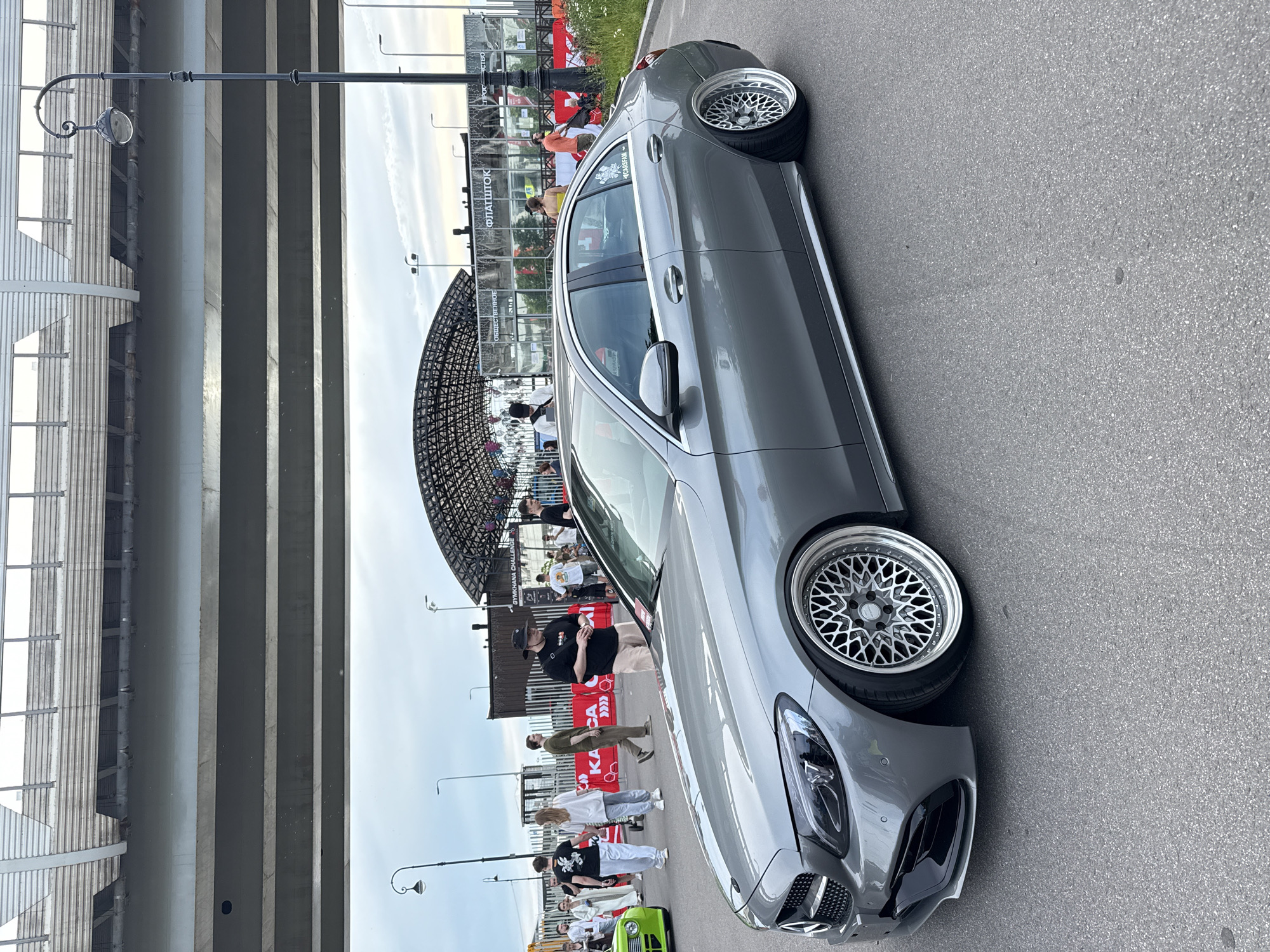 Custom car show under Saint Petersburg's highway overpass near Gazprom Arena