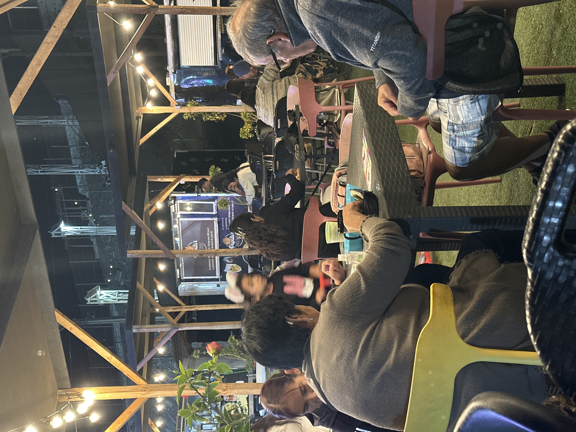 Evening outdoor dining and bingo gathering in Arica, Chile