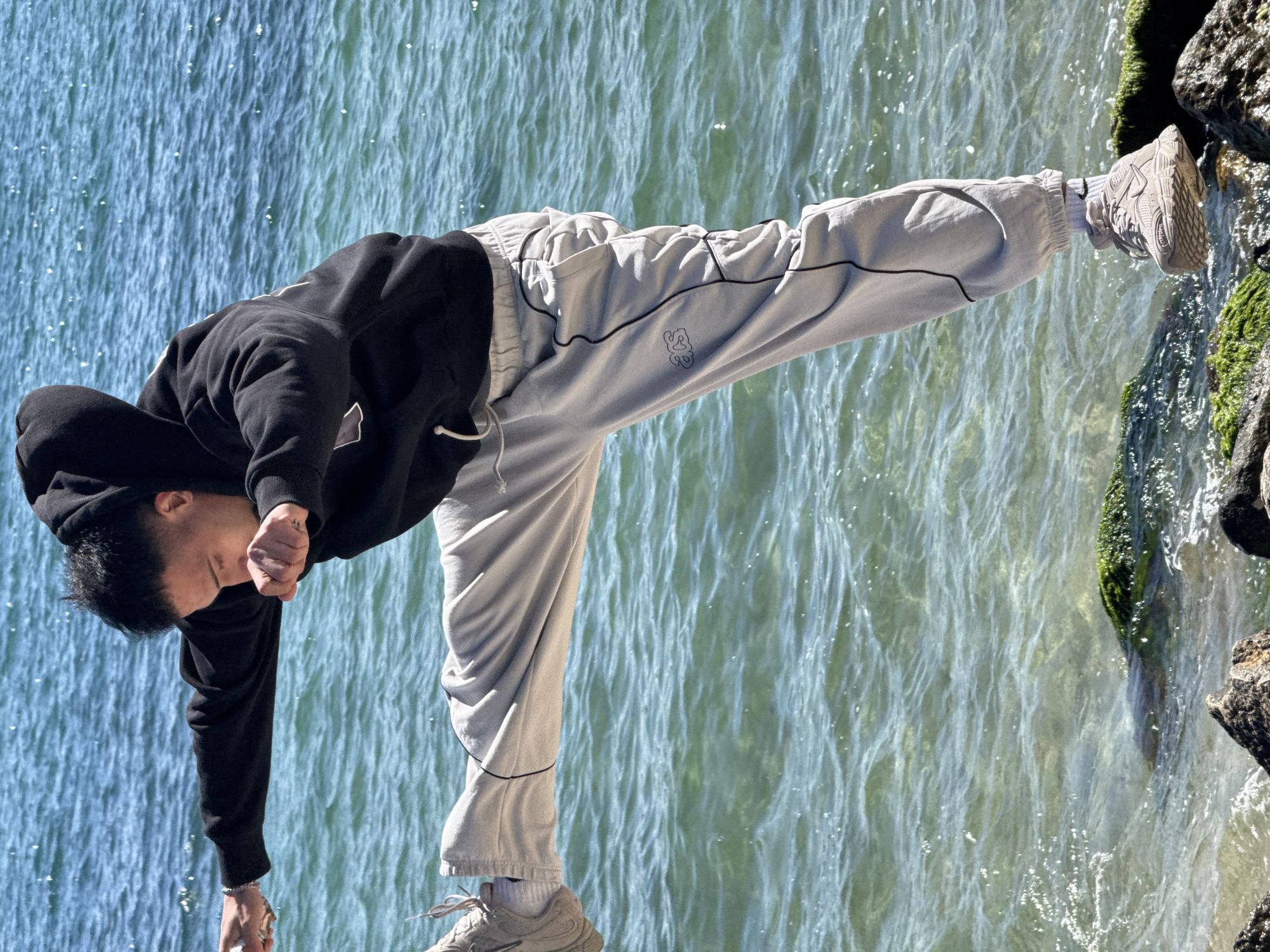 Young man performs coastal acrobatics in sunny Varna, Bulgaria
