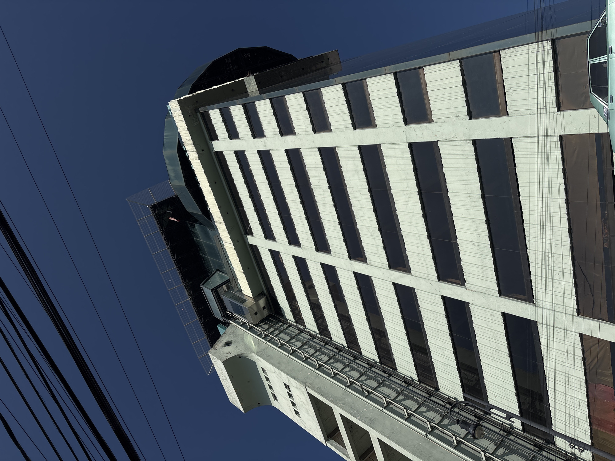 Striped City Express hotel photographed from below in Puebla