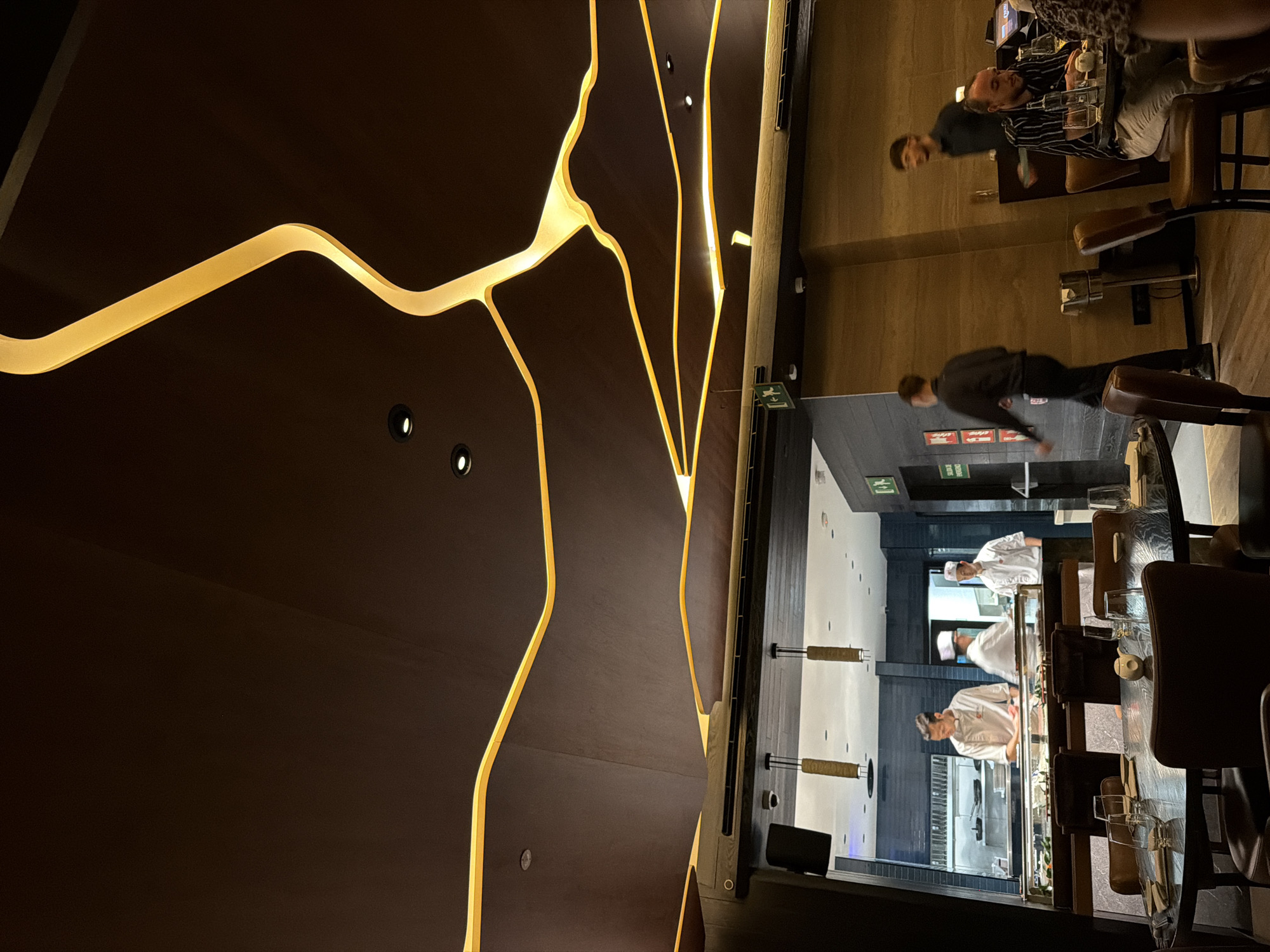 Dinner at a sleek Barcelona restaurant, city views after