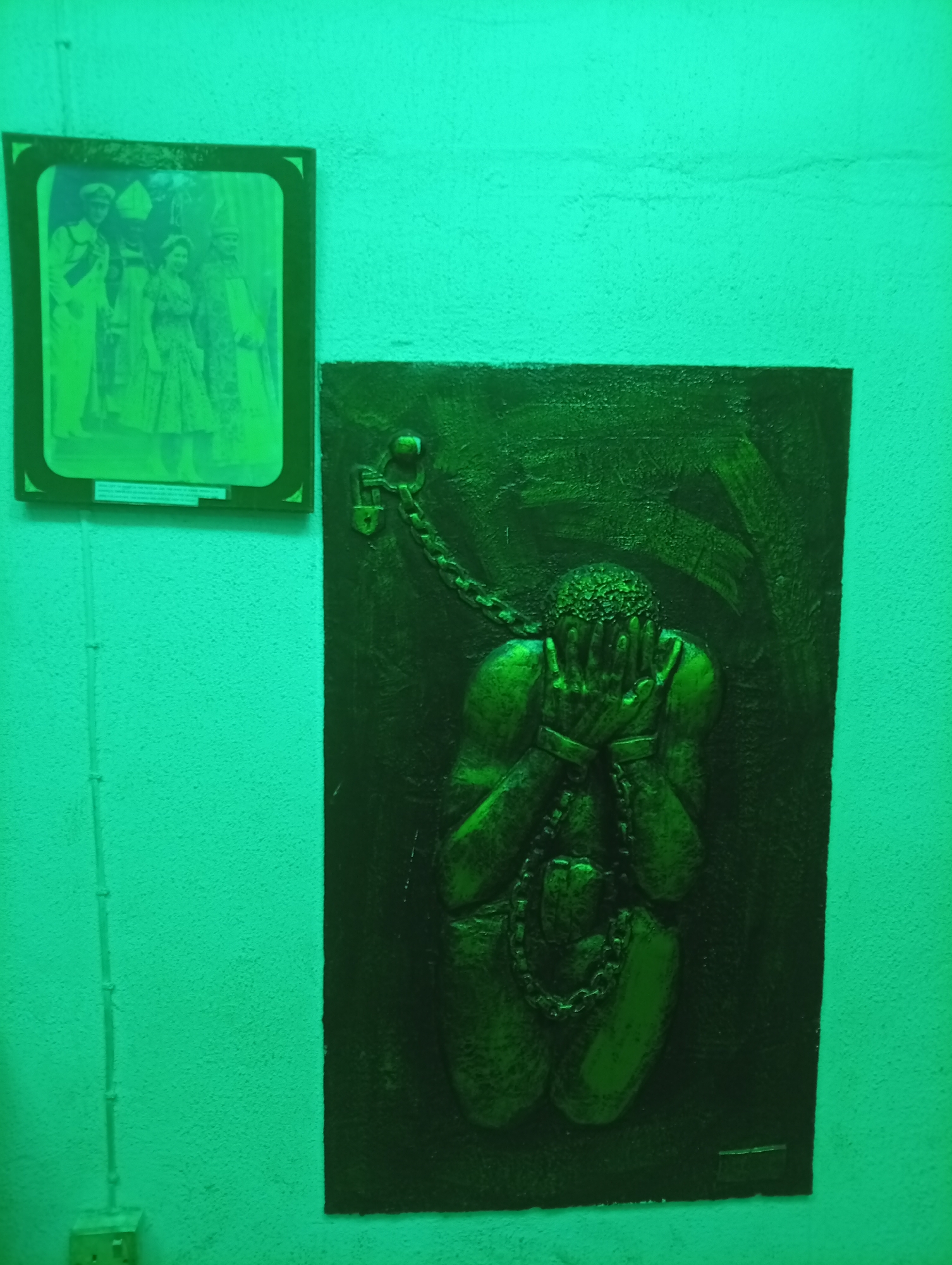 Visitor documents historical exhibits at Badagry slavery museum