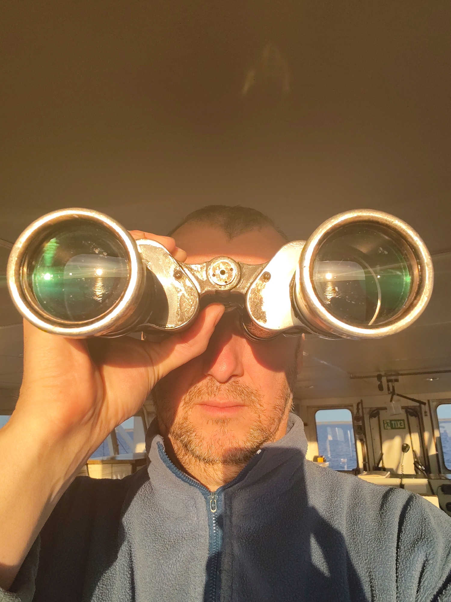 Man with binoculars spotted on ship bridge near Russia